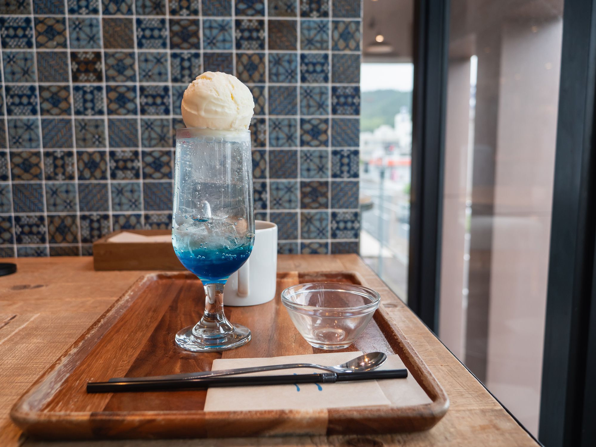 Soda with sweet blue syrup. Vanilla ice cream topping.