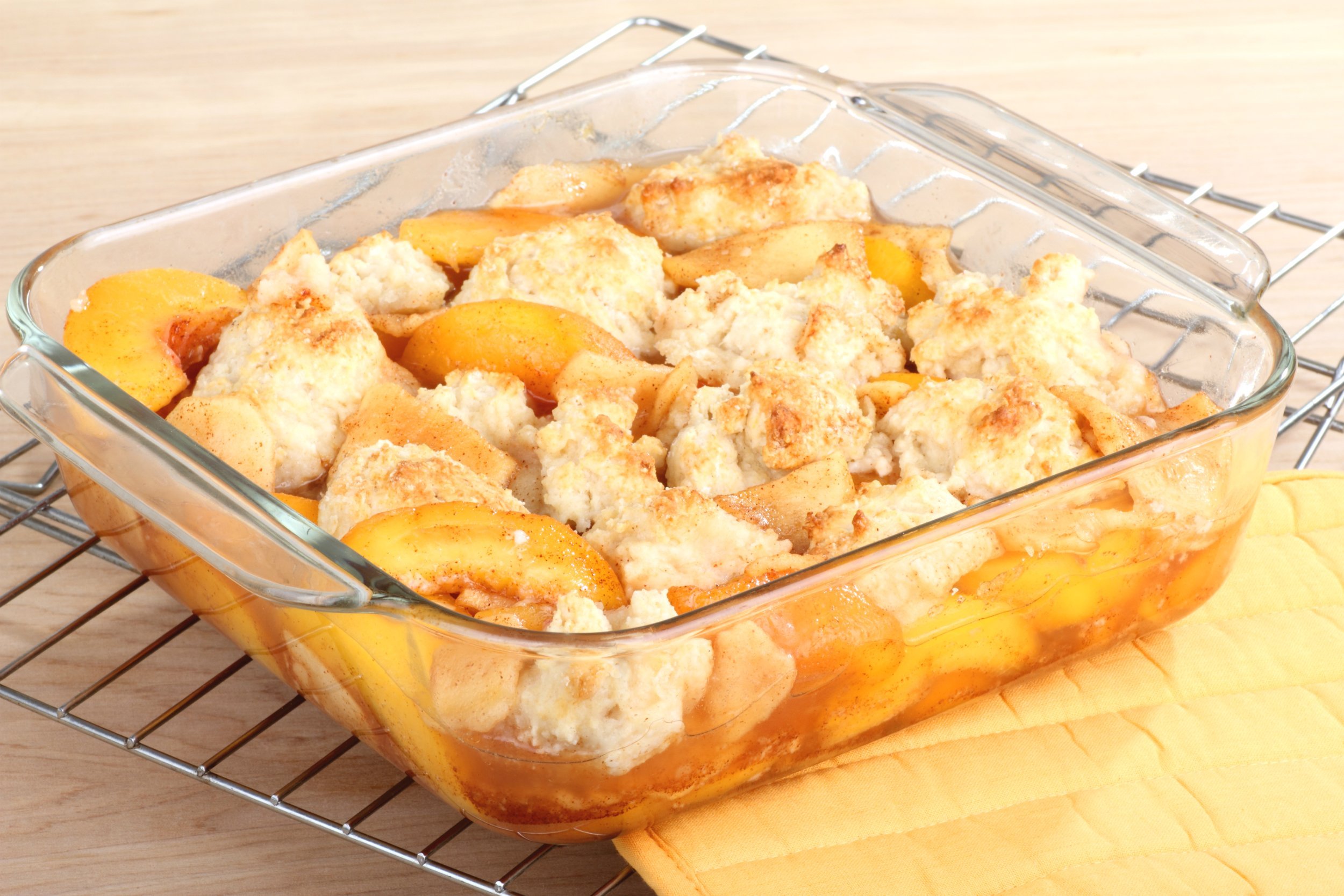 peach cobbler dessert in a baking dish
