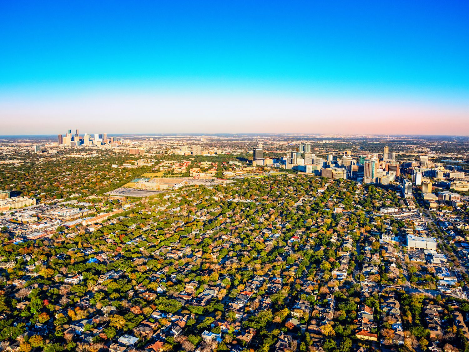 Wide angle view of the metropolitan area of Houston, Texas including the downtown skyline, the Houston Medical Center and the surrounding suburban neighborhoods shot from an altitude of about 1500 feet.