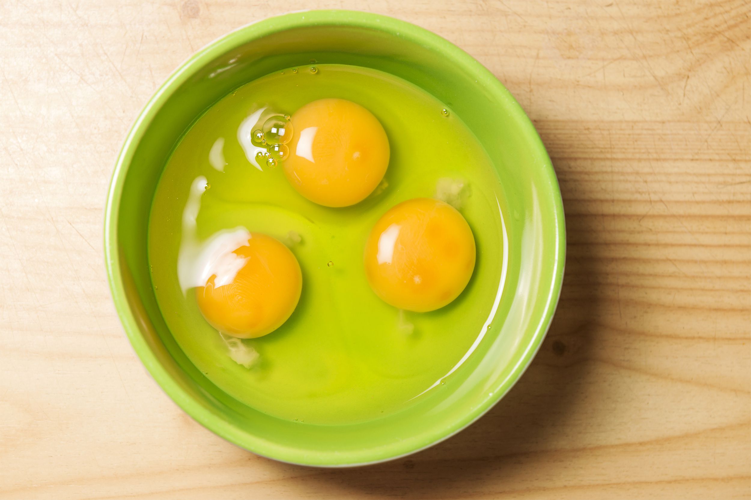 Raw eggs in a bowl