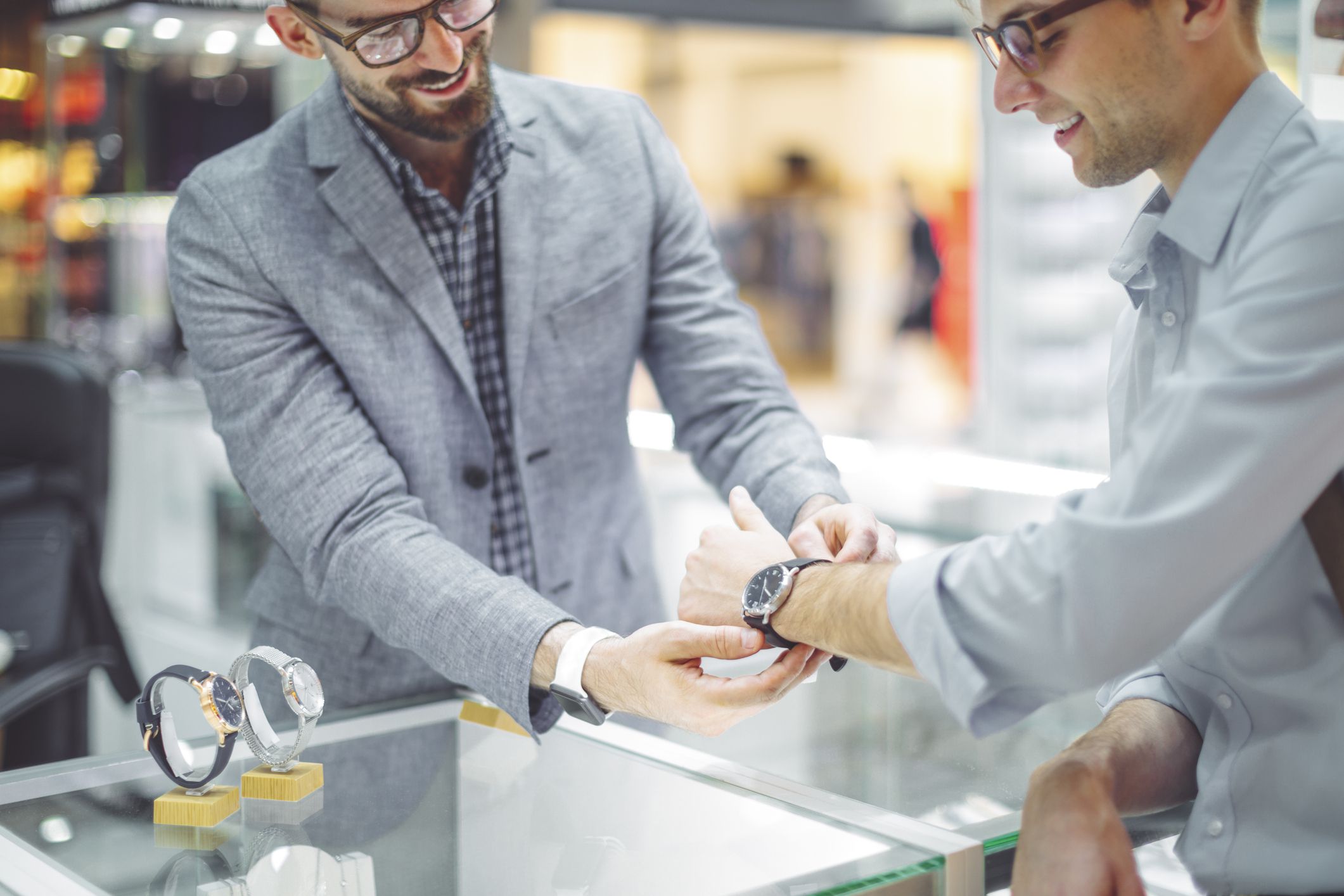 Young man is shopping for a watch