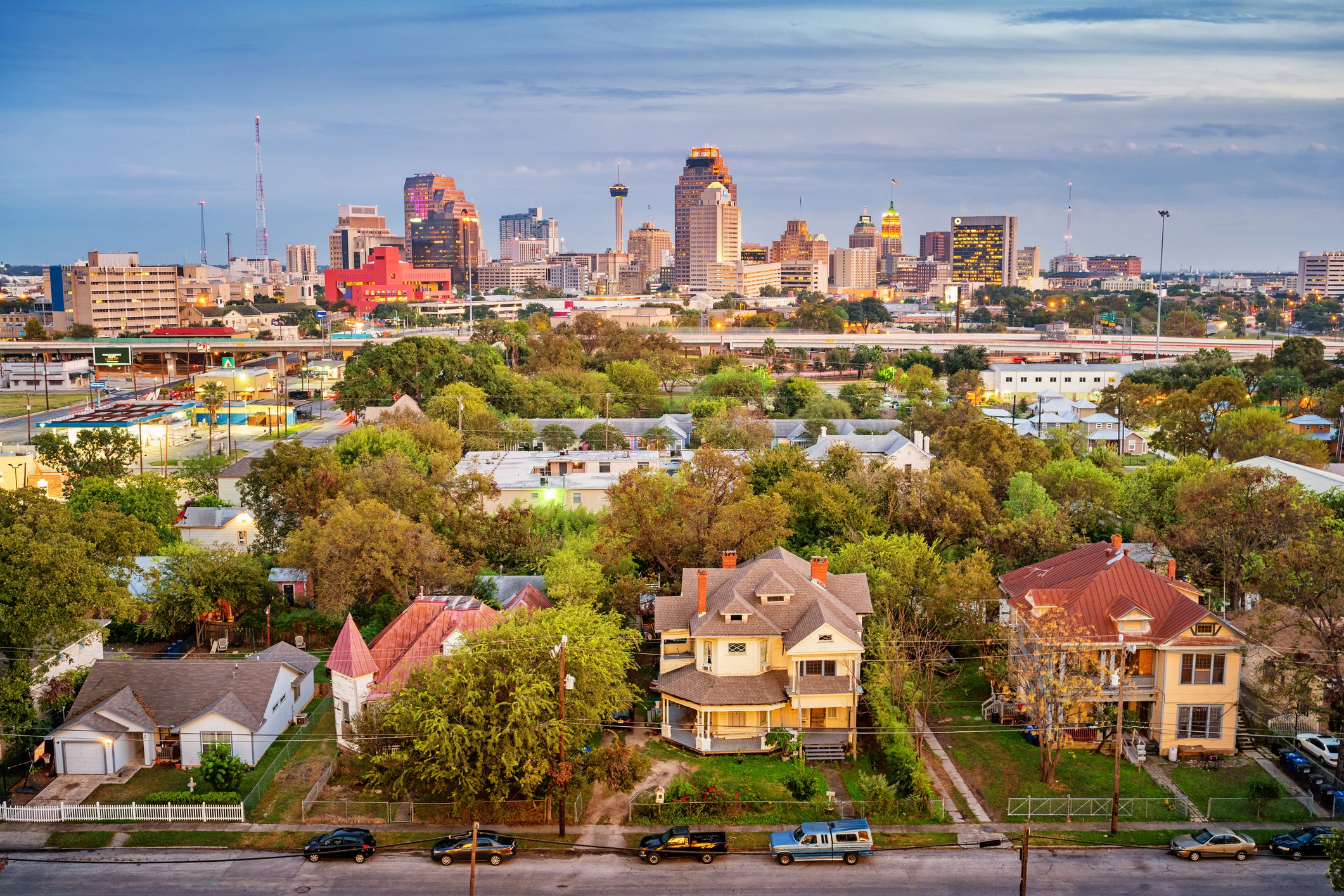 Stock photograph of a residential district and the downtown skyline of San Antonio Texas USA at twilight.
