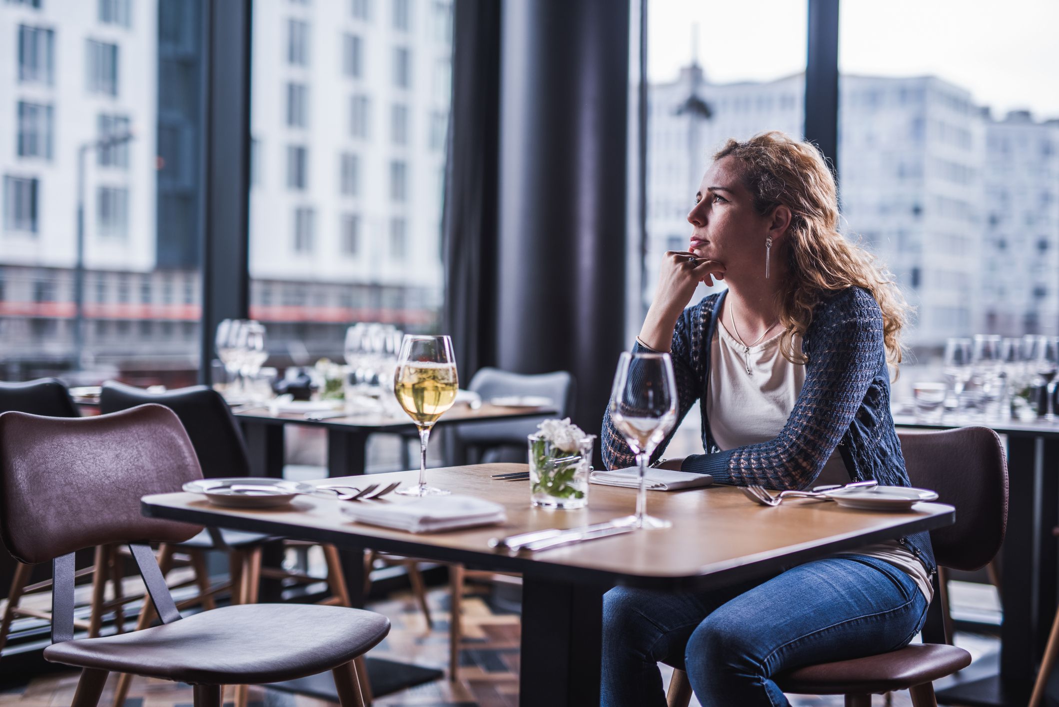 Lonely woman in restaurant.