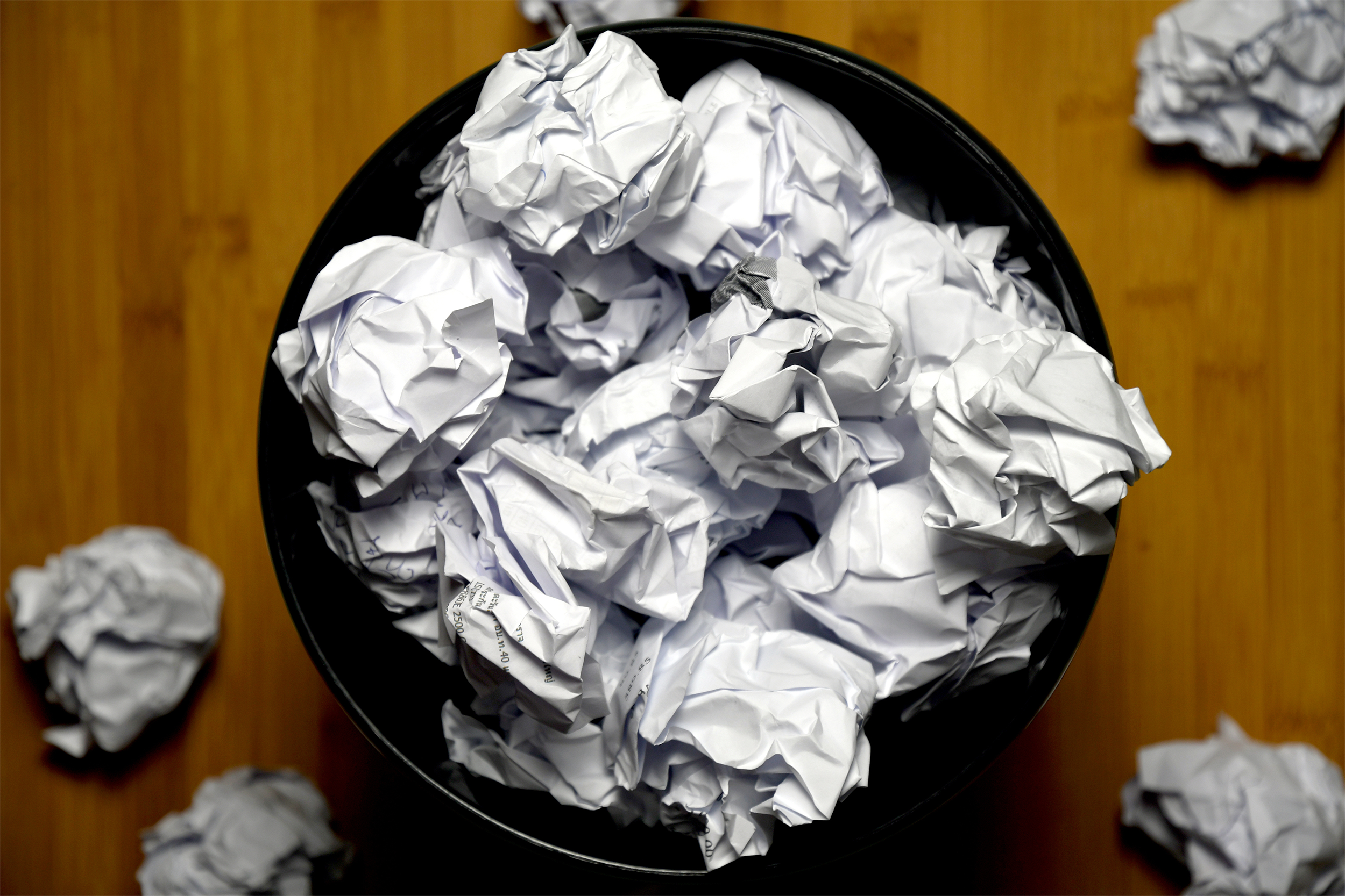trash can with crumpled papers