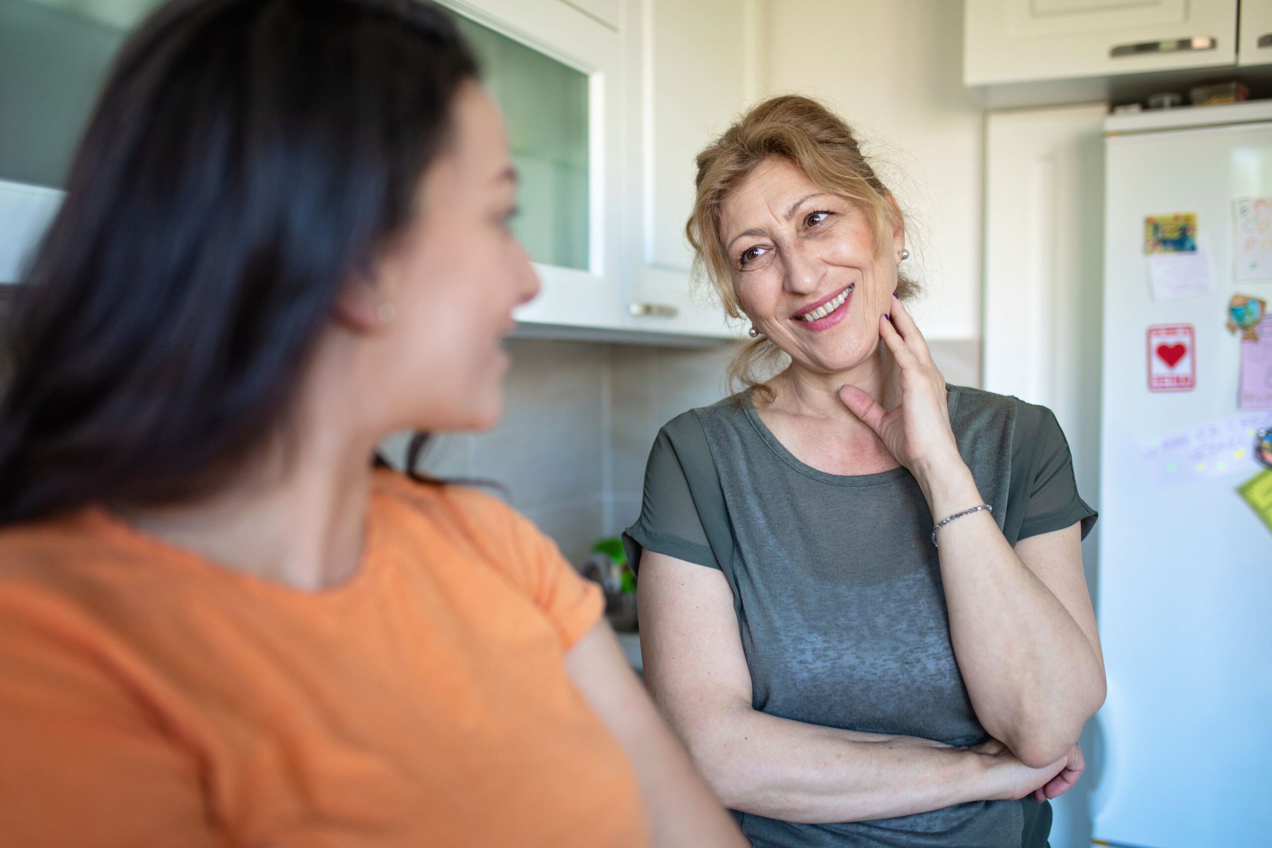 Women talking in kitchen