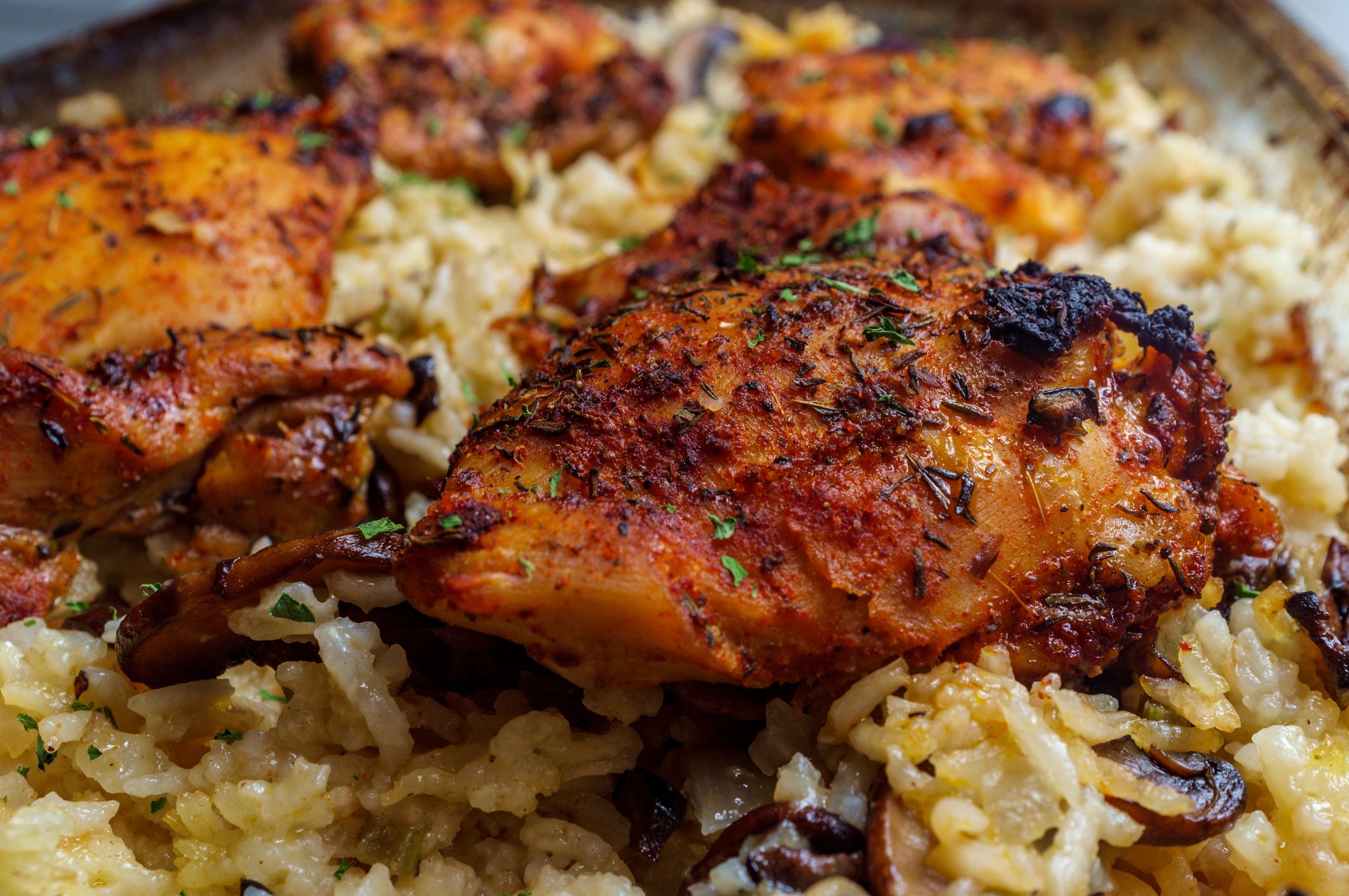 Italian garlic boneless and skinless chicken thighs and rice casserole with mushrooms and olives