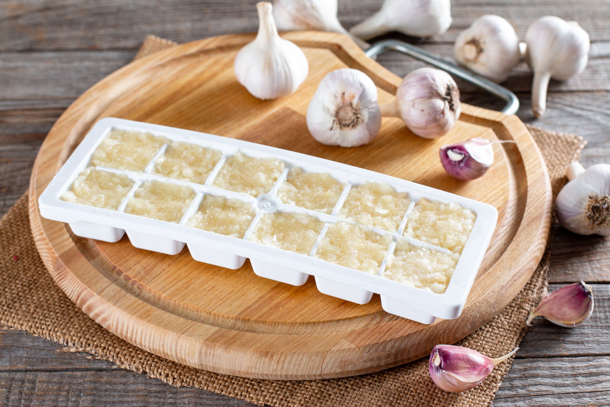 Frozen garlic. Frozen garlic puree on wooden table. Frozen food Concept