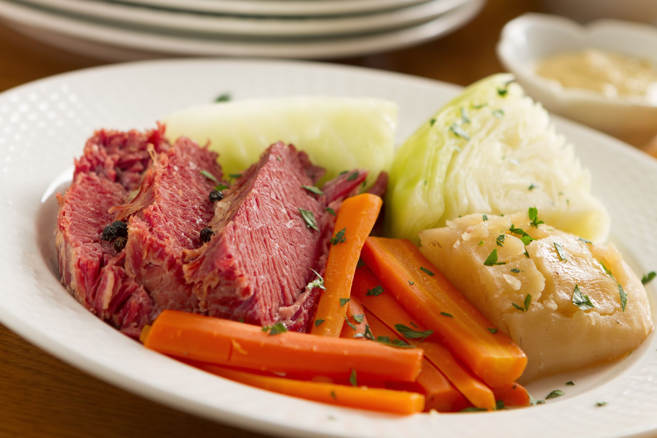 A classic boiled dinner of corned beef, cabbage, potatoes, onions, and carrots.