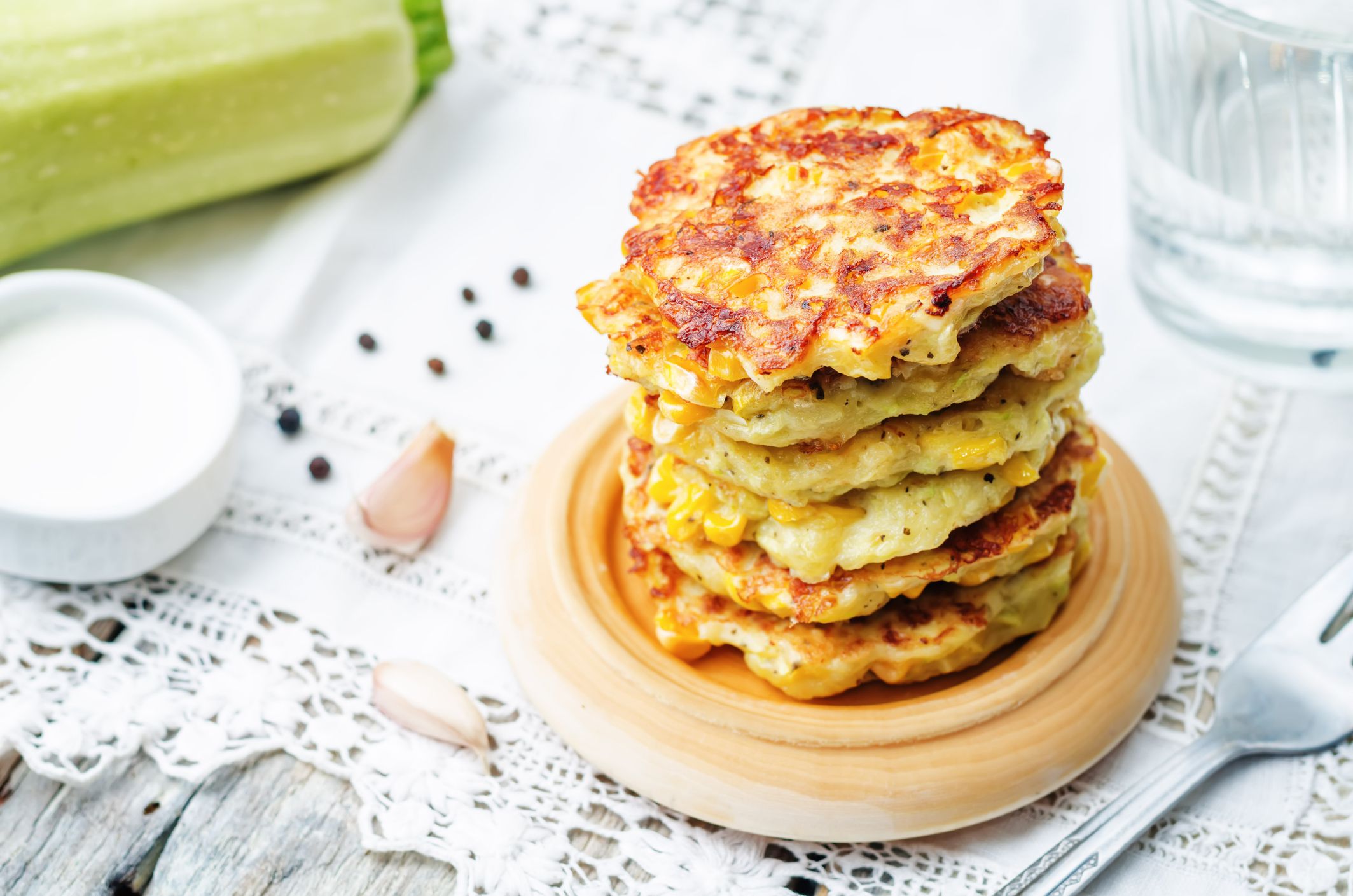 zucchini corn fritters on a white background. the toning. selective focus