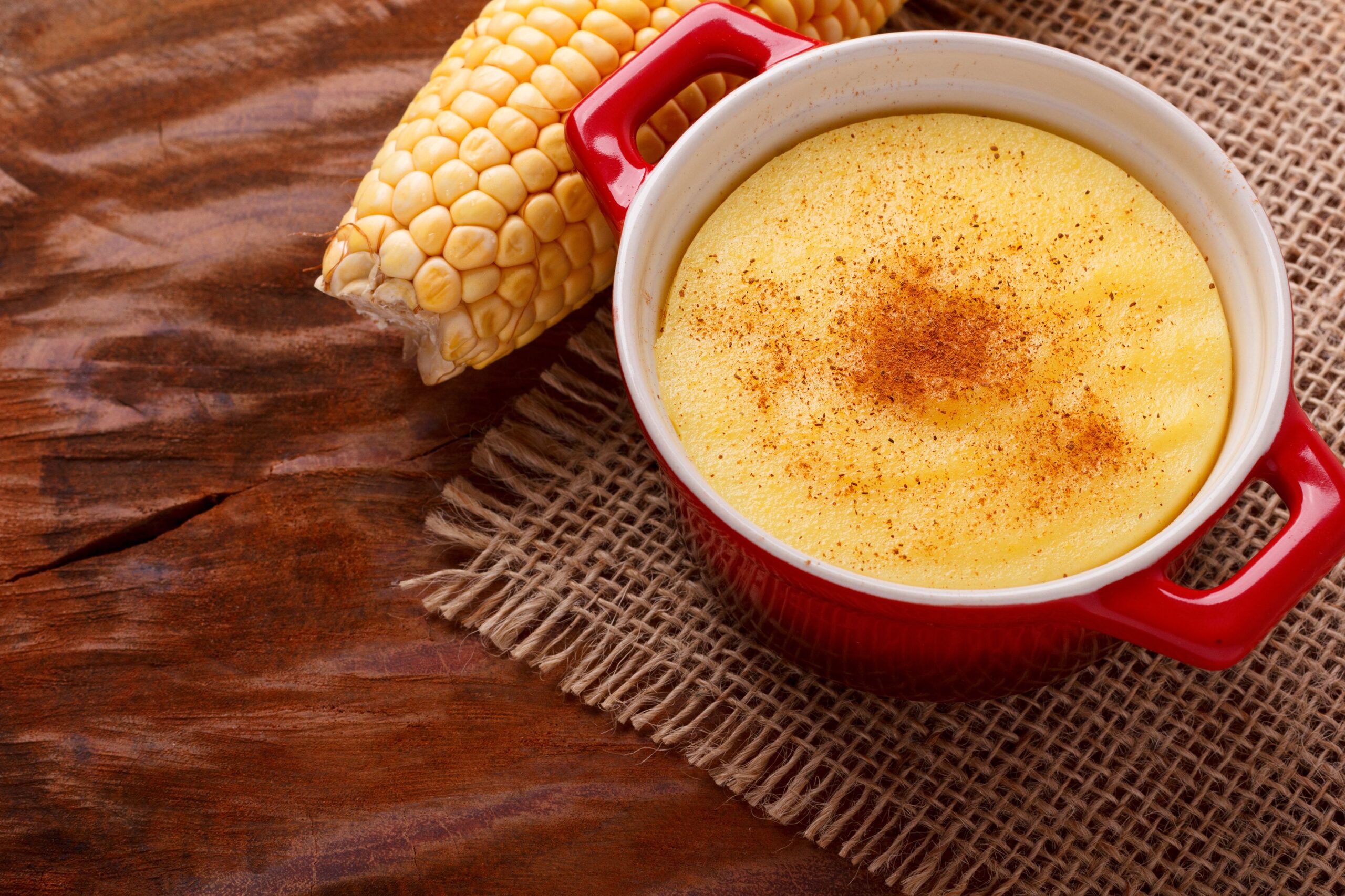 Brazilian sweet custard-like dessert curau de milho mousse of corn with cinnamon. Selective focus. Copy space