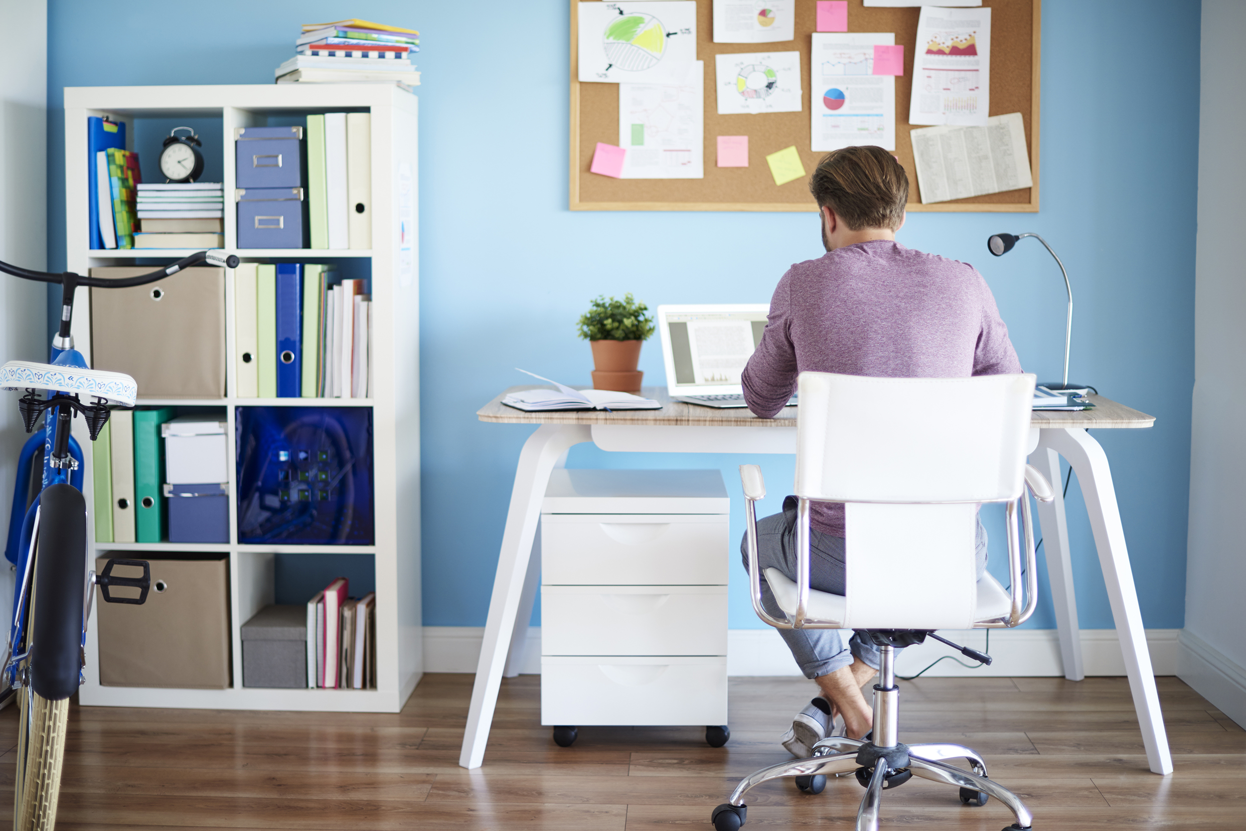 View of man working in his home office