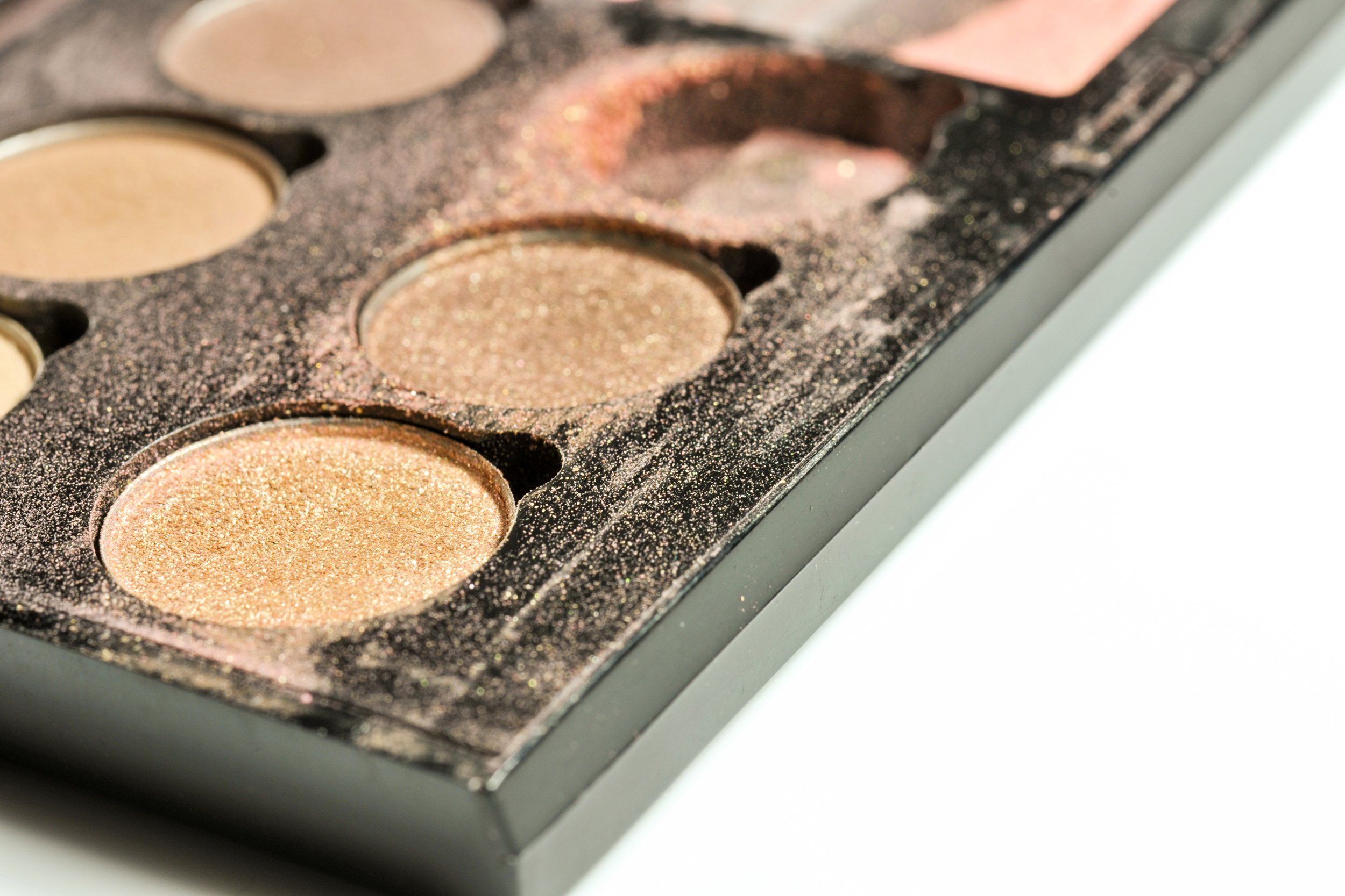 used broken eye shadow in container