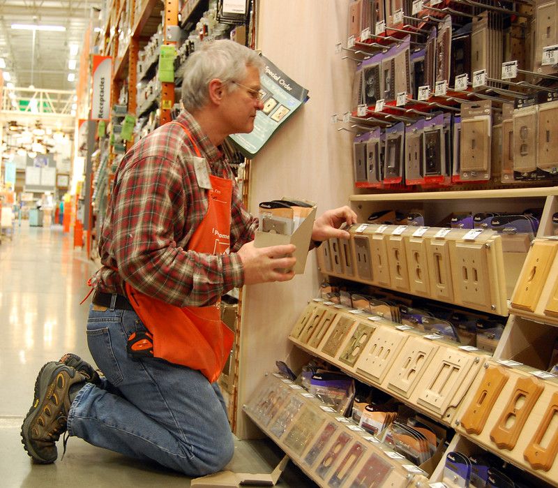 A Home Depot employee stocks shelves Feb. 16, 2011. Home Depot is looking for employees this Spring to assist in several departments.