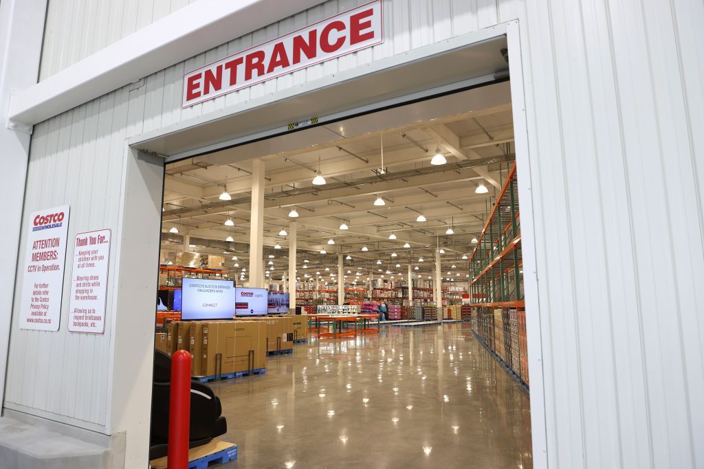 The entrance to a New Zealand Costco — lights glitter inside the warehouse