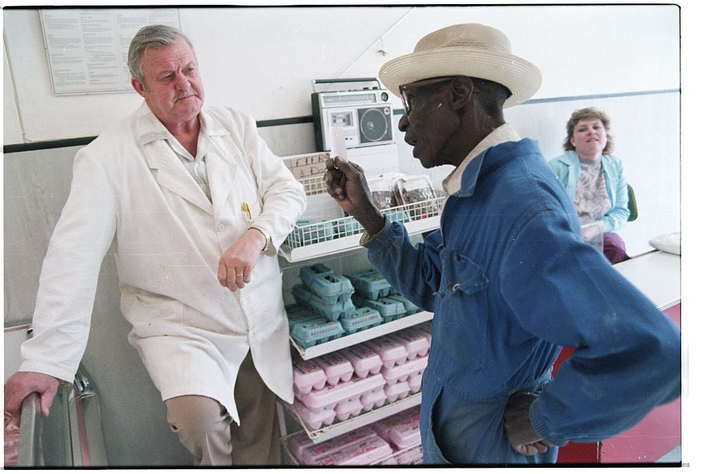 Butcher Speaking with a Customer 1980s