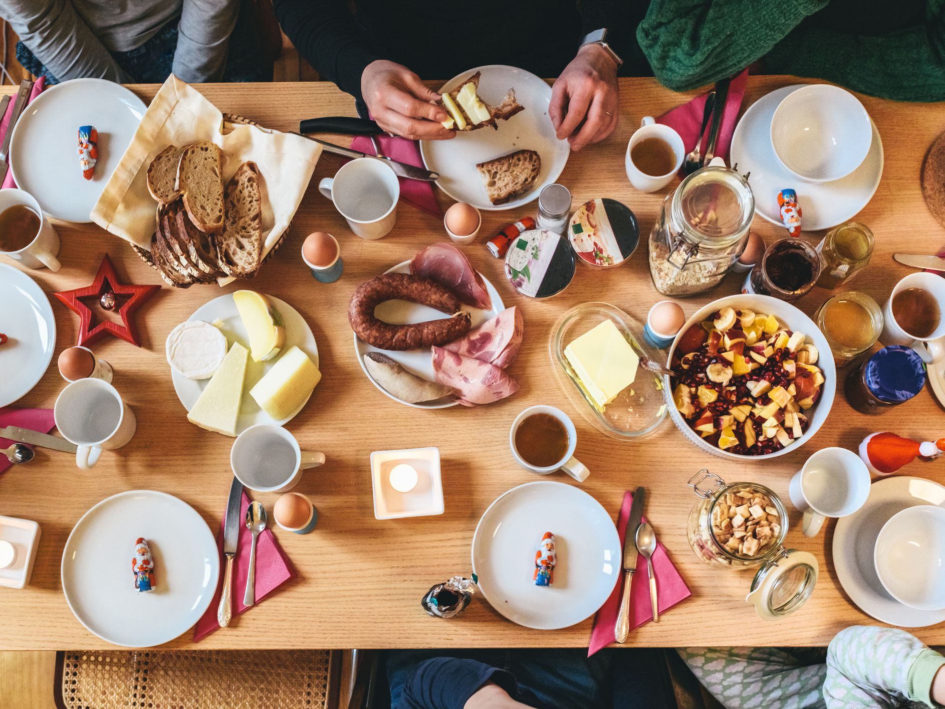 overhead view on family sitting around brunch table in advent