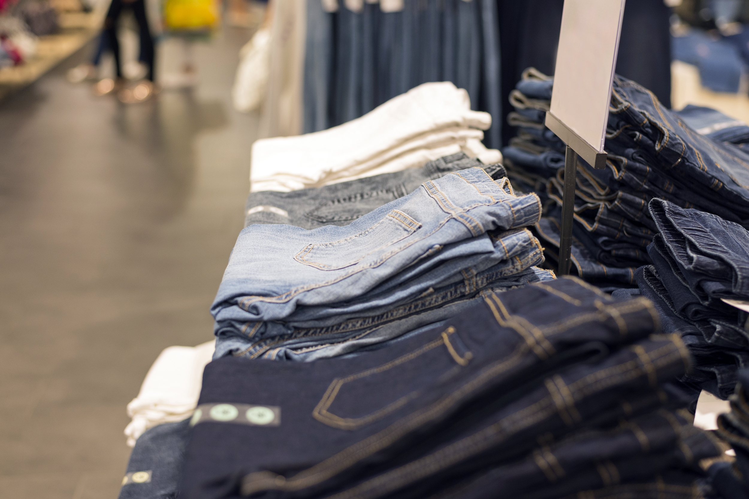 Jeans on a shelf in a store