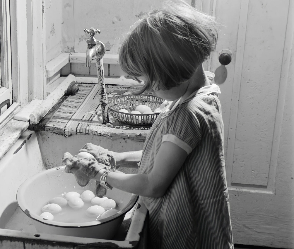 Girl Washing Eggs to Be Sold at Market | 1940 |