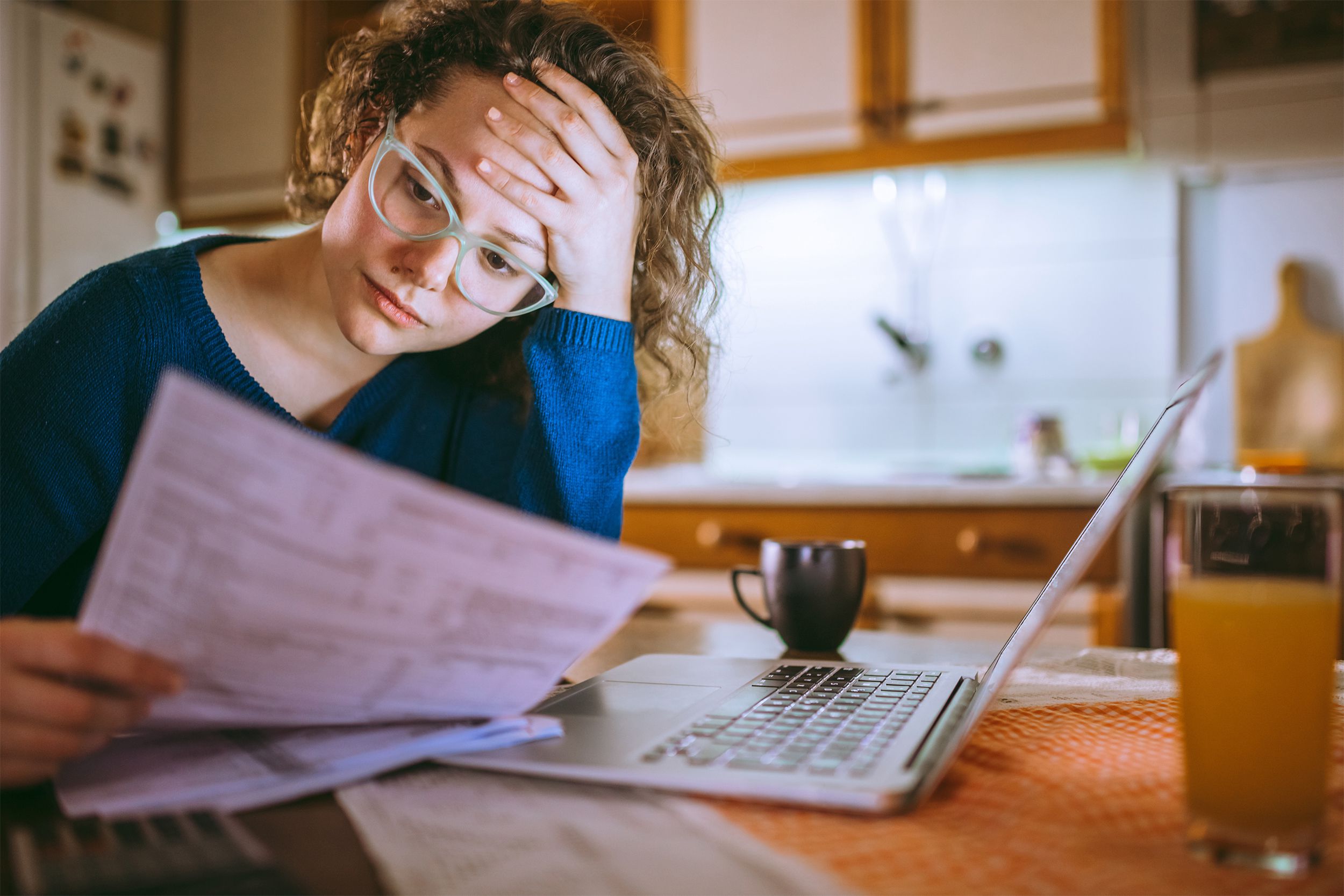 woman looking at bill