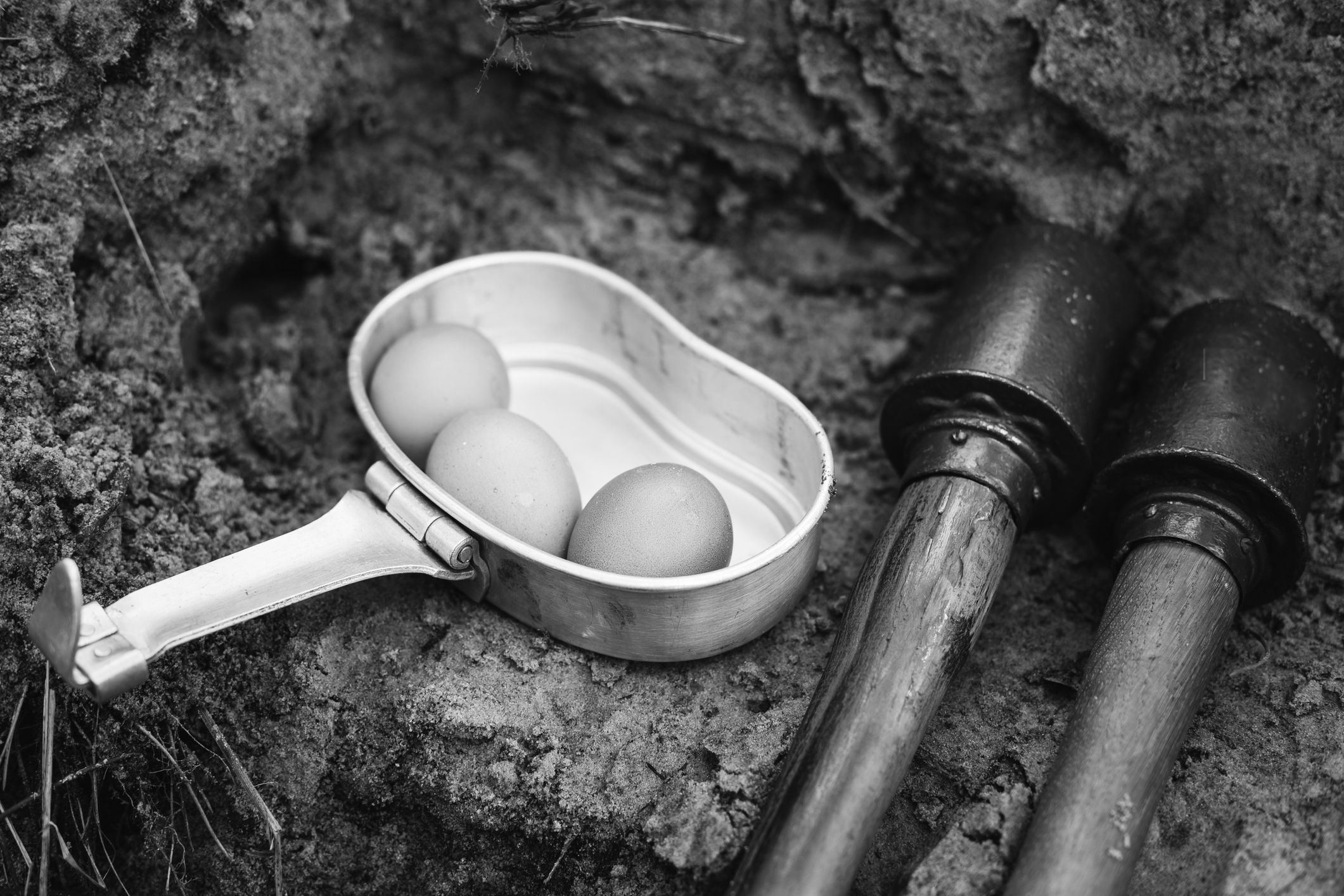 German Military Ammunition Of World War Ii On Ground. Grenades. Photo In Black And White Colors.