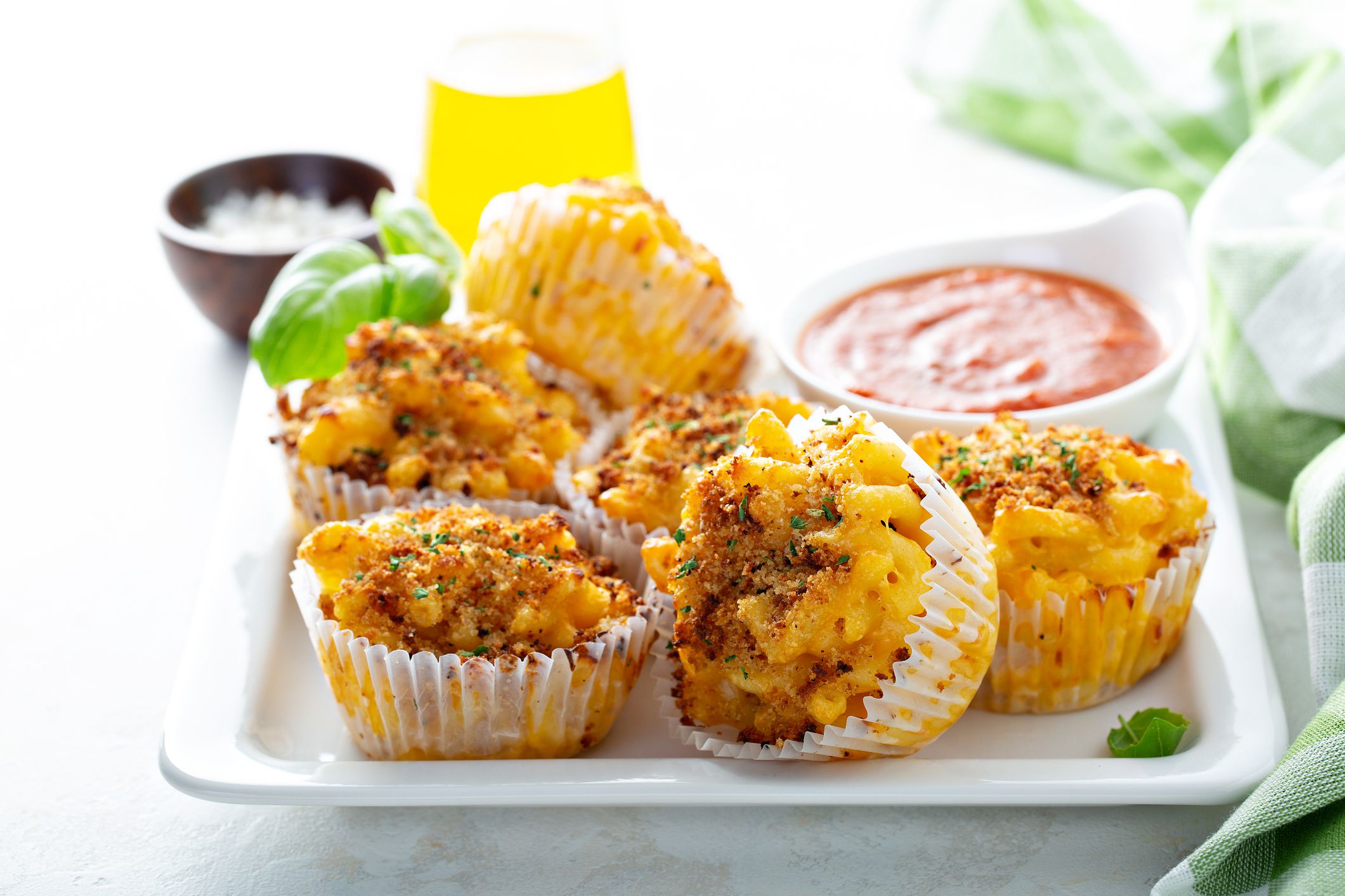 Baked mac and cheese muffins with marinara sauce
