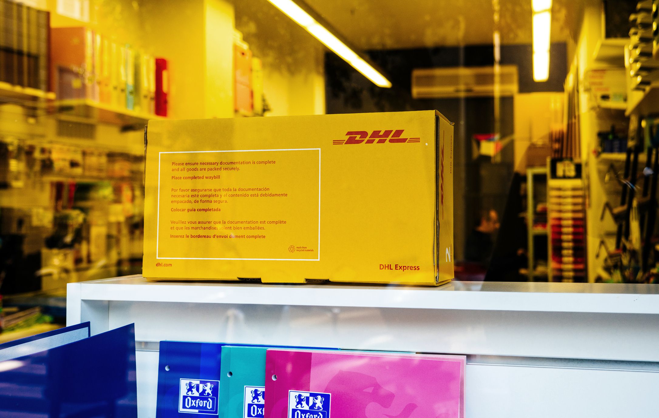 Barcelona, Spain - Nov 13, 2017: DHL express parcel in the window shopping of Barcelona tobacco shop