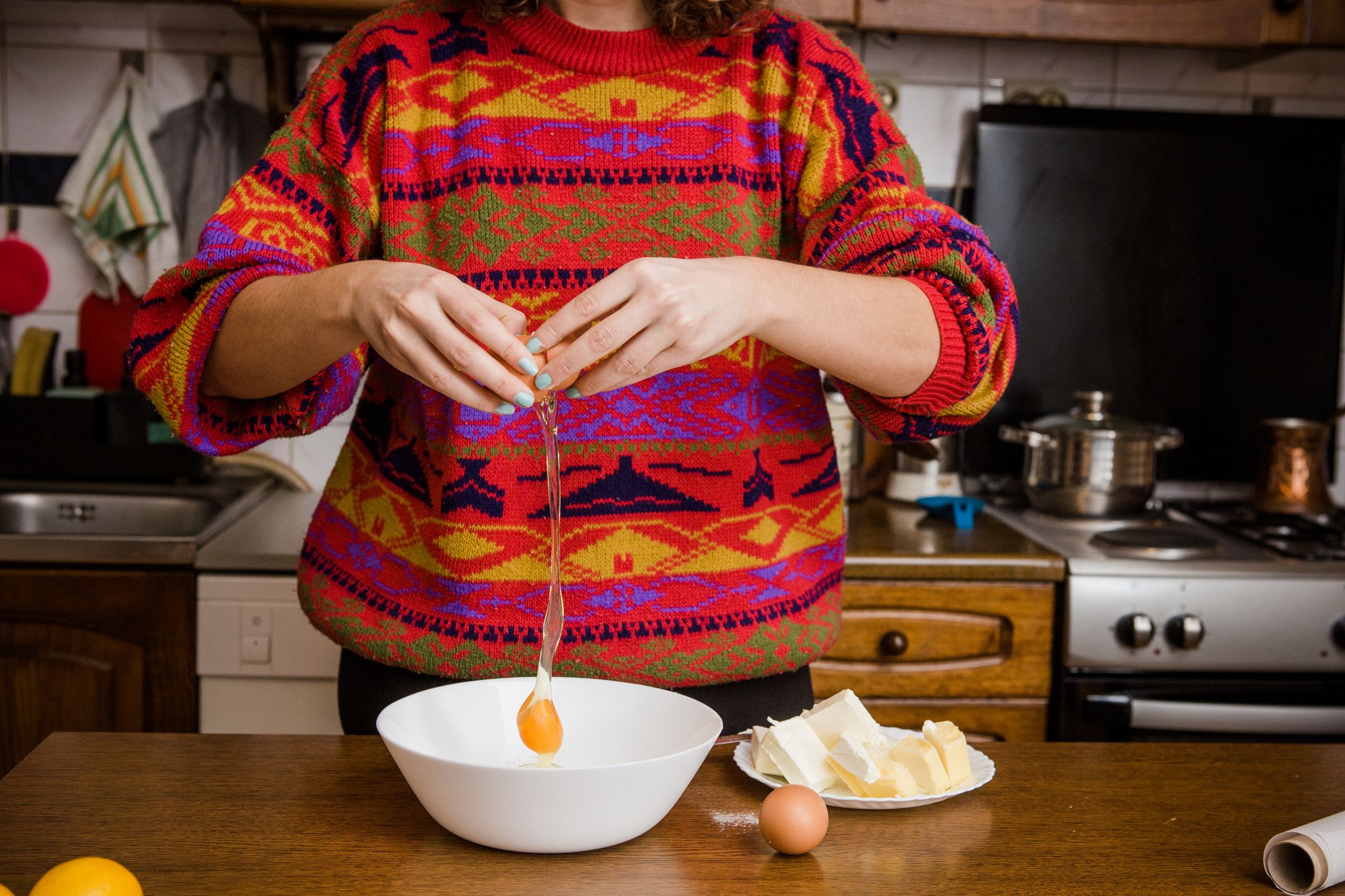 Caucasian Woman Preparing Christmas Cookies in the kitchen.