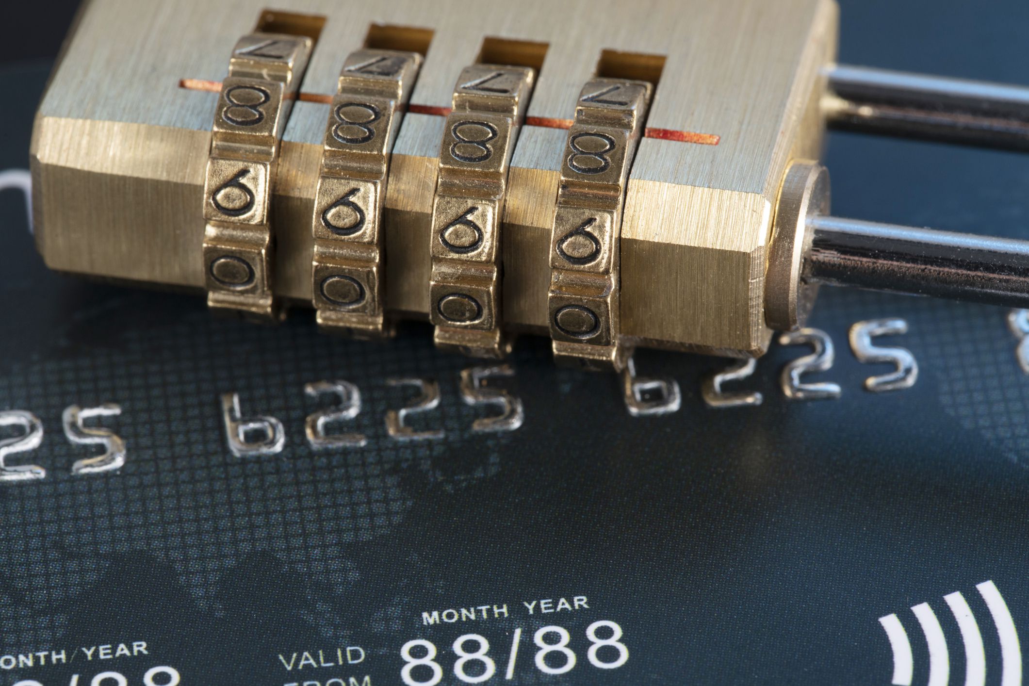 A closeup shot of a lock on credit cards - credit card data security concept