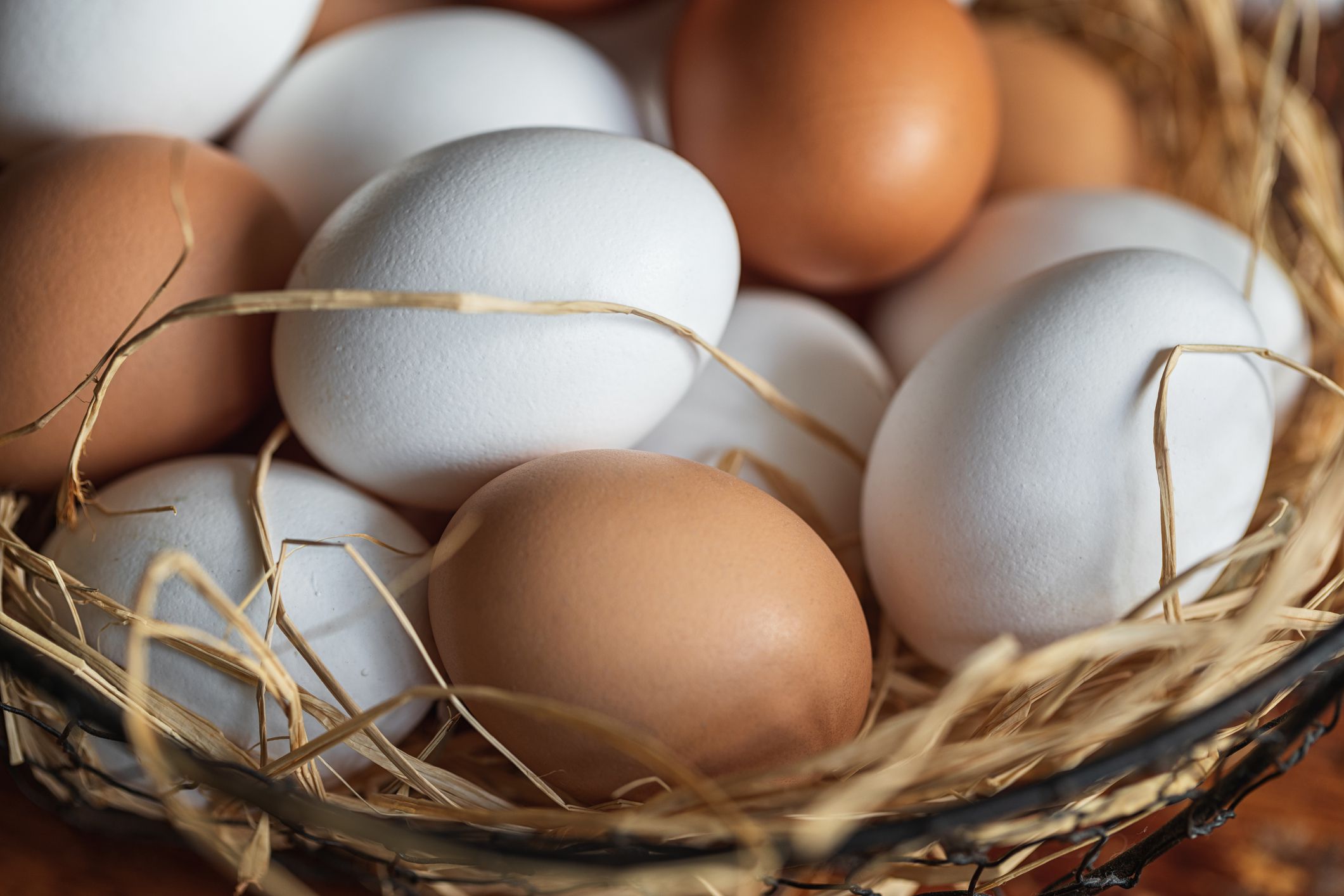 Fresh organic chicken eggs on a wooden rustic background