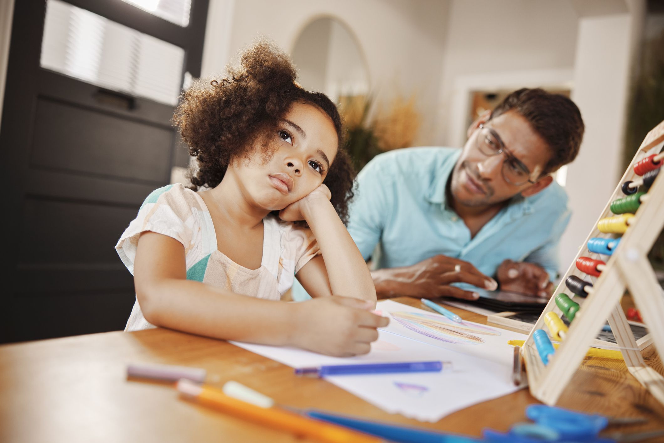 Bored, father or girl learning drawing skills or homeschooling with autism in interracial family house. Worried Indian dad or creative kid thinking or writing homework in child development education