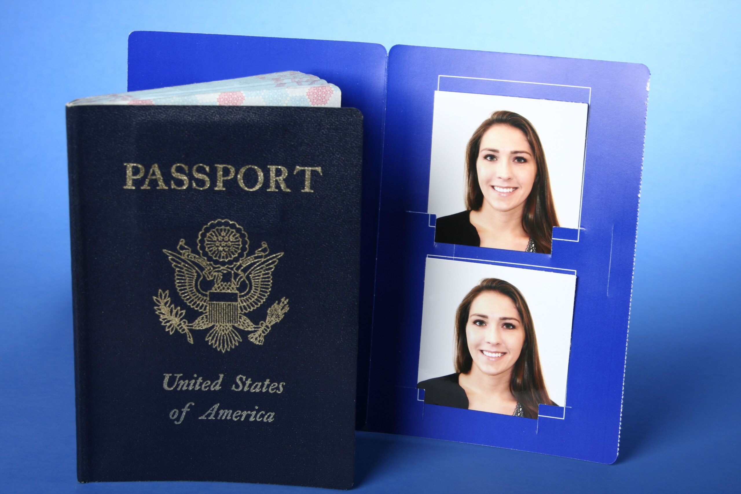 USA Passport with Passport Photos on Blue Background