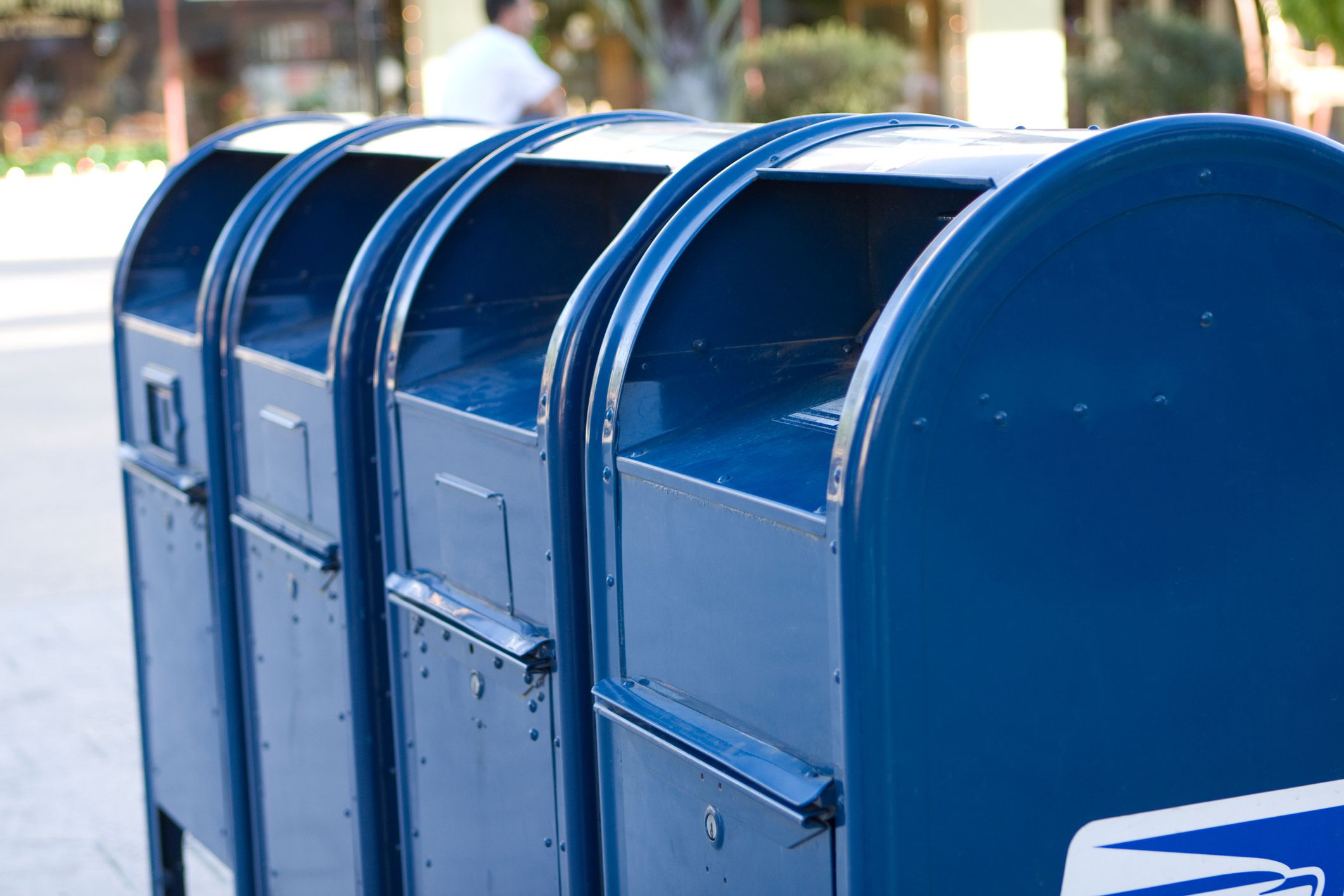 A row of blue mailboxes