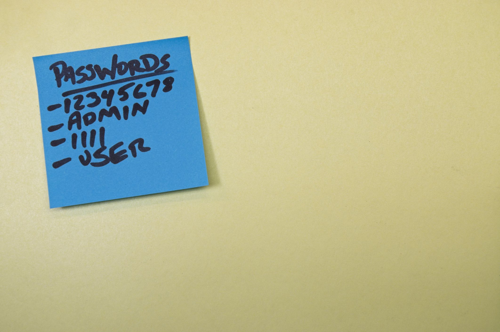Password list on a blue sticky note