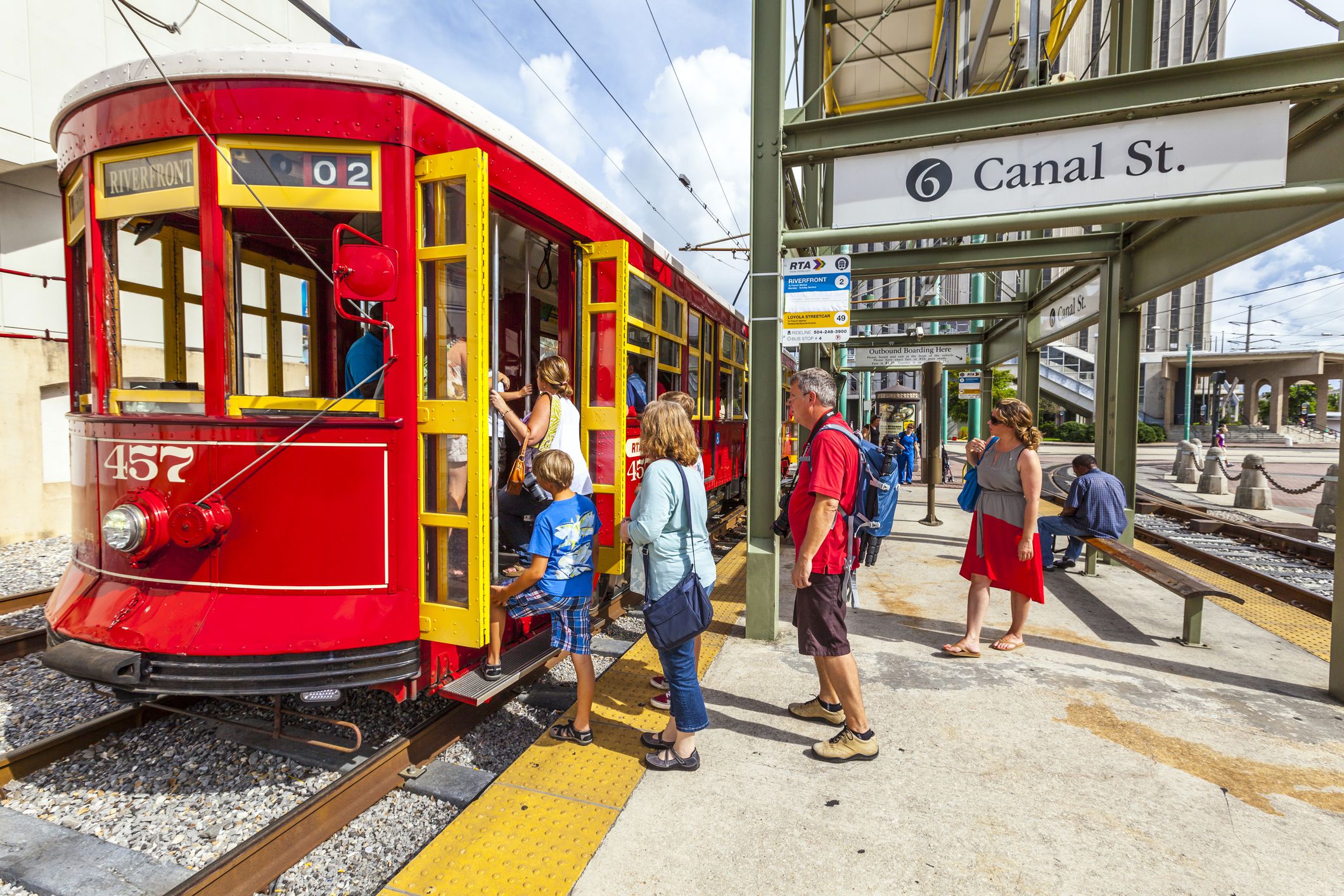 New Orleans, USA - July 16, 2013: people enter the riverfront Streetcar Line in New Orleans, USA. Revamped after Hurricane Katrina in 2005, the New Orleans Streetcar line began electric operation in 1893.