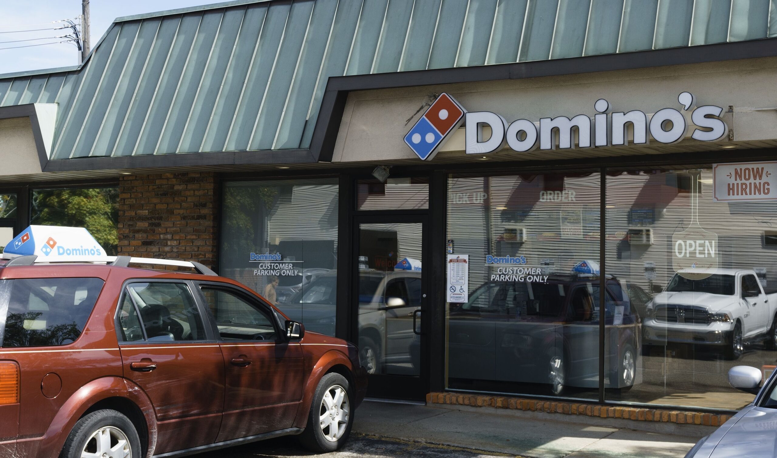Rochester, Michigan, USA - September 16, 2016: A Domino's Pizza location in Rochester. Founded in Ann Arbor, Domino's has locations across the US and in 81 countries internationally.