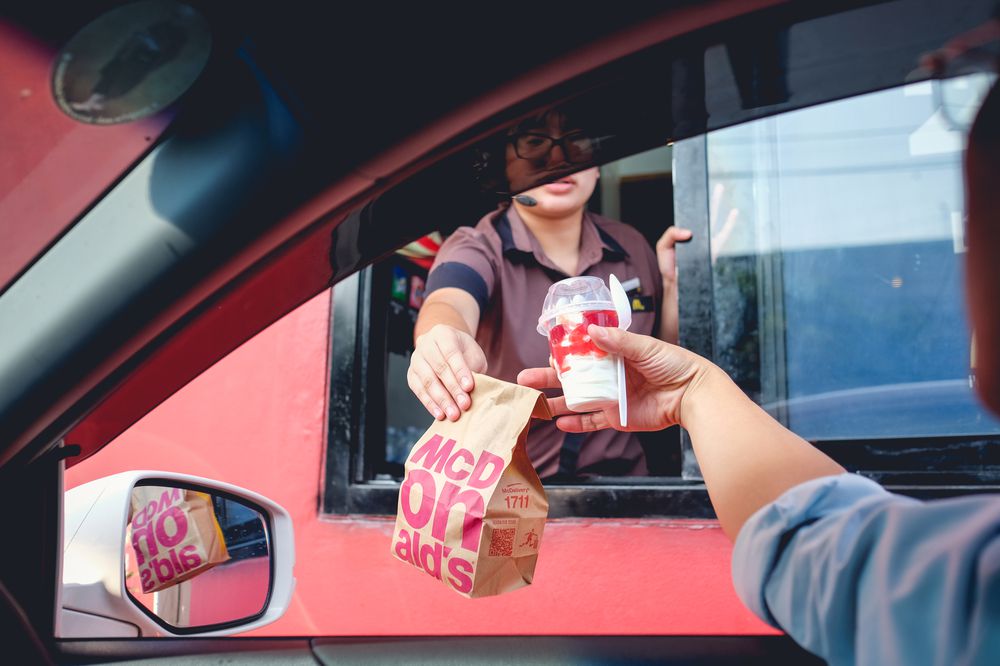 Bangkok, Thailand - Mar 4, 2017: customer receiving hamburger and ice cream after order and buy it from McDonald