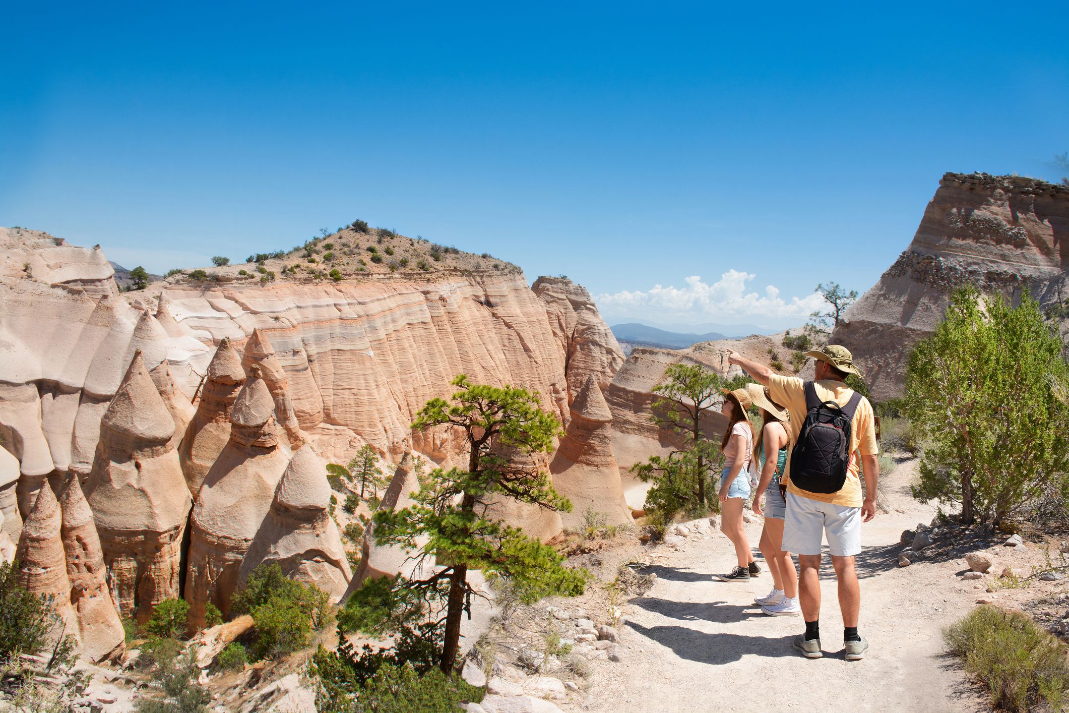 Family on hiking trip in beautiful mountains. Kasha-Katuwe Tent Rocks National Monument, Close to of Santa Fe, New Mexico, USA
