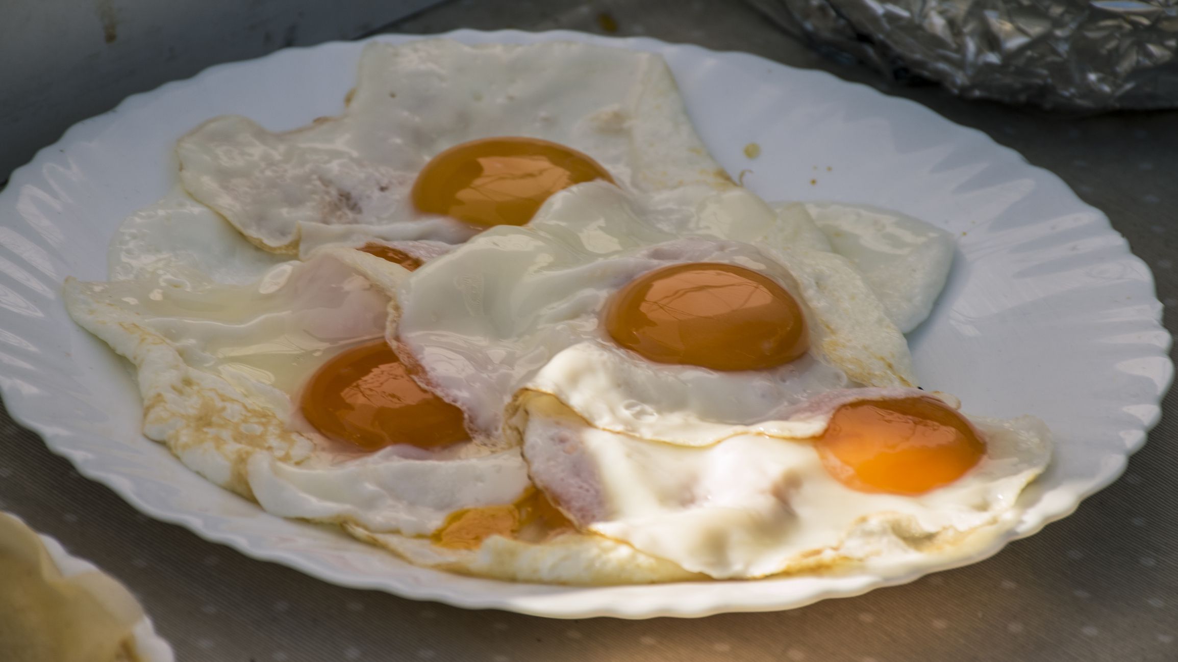 Plate of fried eggs in a street store in old Madrid. In the area of Madrid de los Austrias