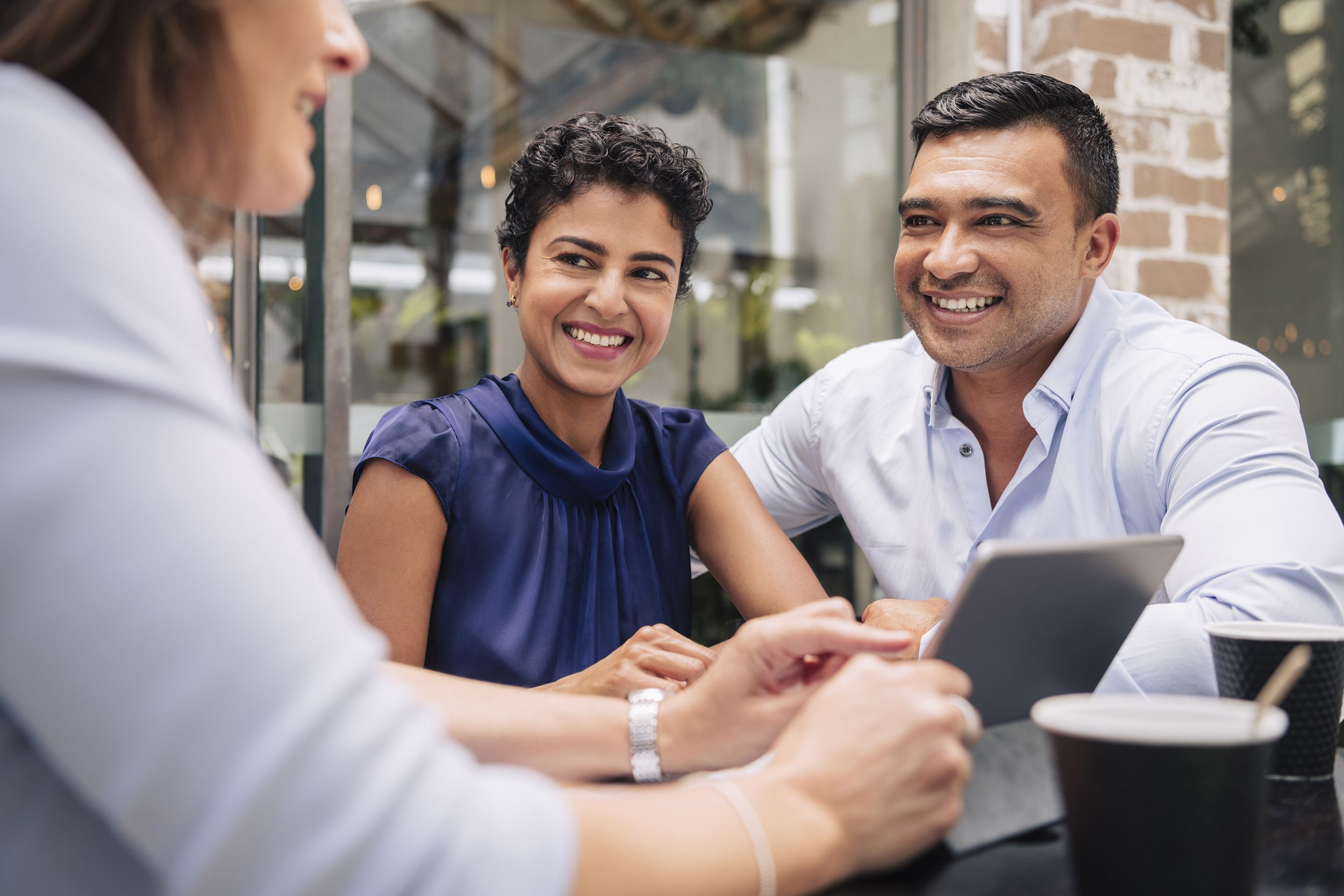 happy couple receive good news from accountant