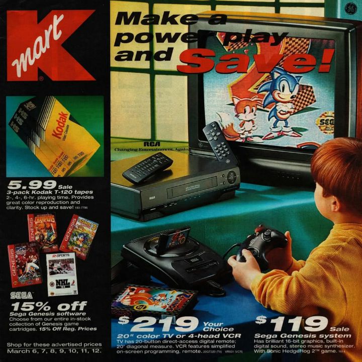 A vintage Kmart advertisement featuring a Sega Genesis system connected to a TV displaying a Sonic game. The ad includes prices for Sega software, Kodak T-120 tapes, and a 20