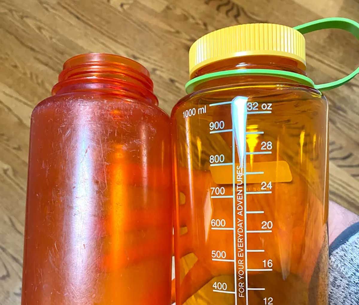 Scratched up old Nalgene bottle and a new one