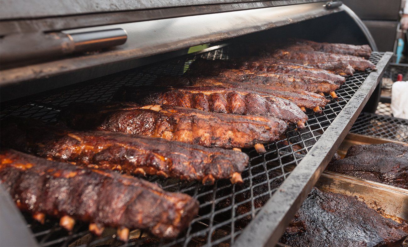 Ribs on the grill at Pig Rig BBQ