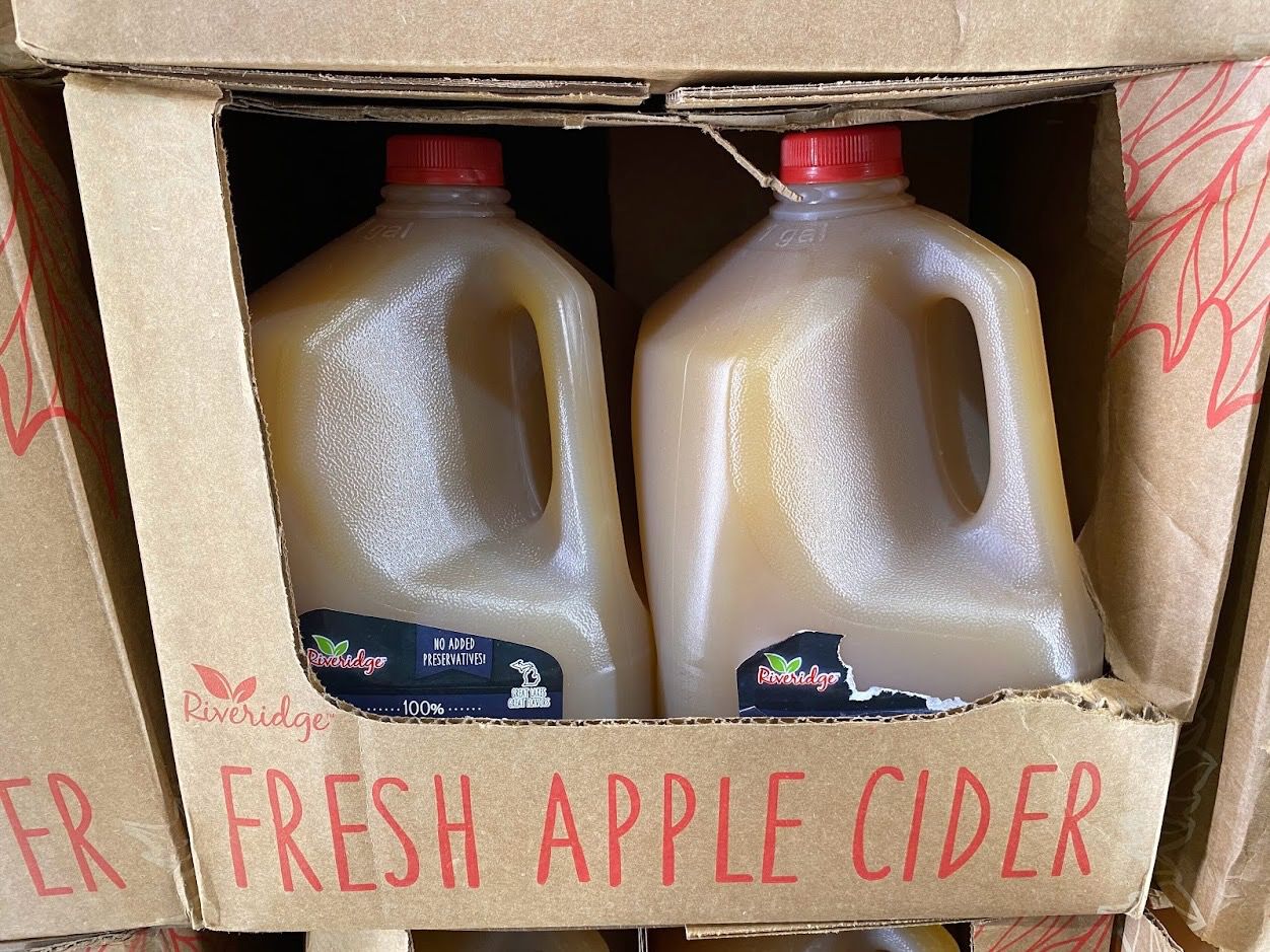 Fresh apple cider jugs at Costco.