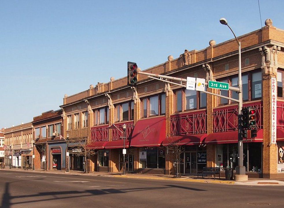 Center of town street in Hibbing, MN, run down brick buildings