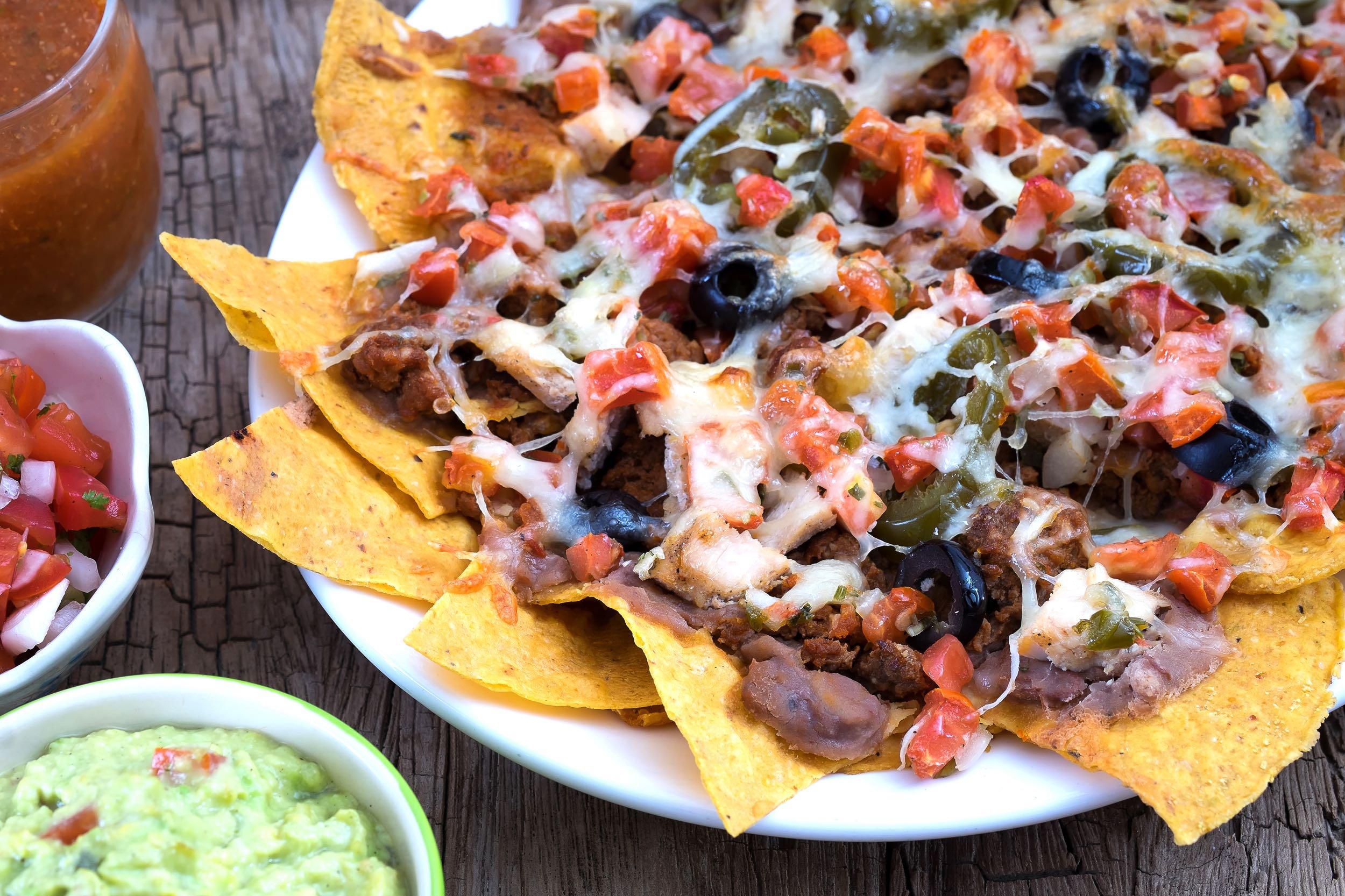 Large portion of Nachos, salsa and guacamole