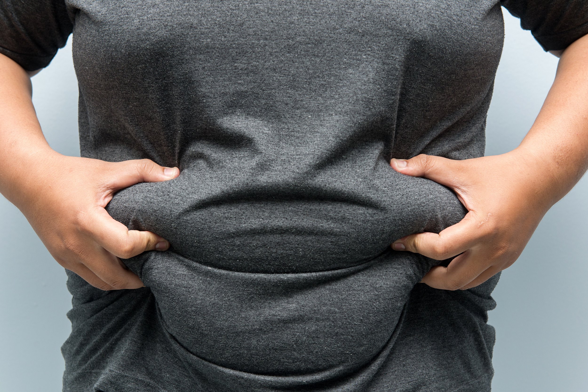 Man holding his stomach fat