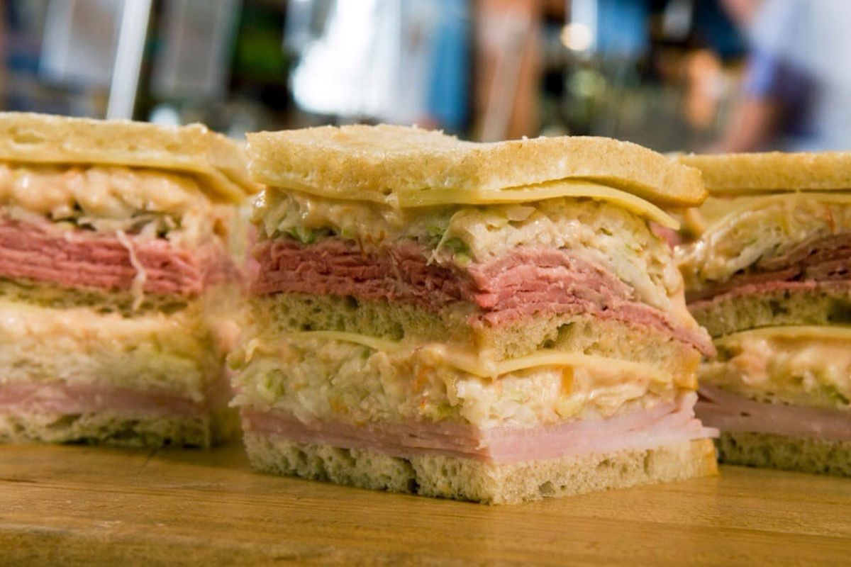 Closeup of Sloppy Joes on a wooden board, Town Hall Deli, South Orange, New Jersey, with a blurred background