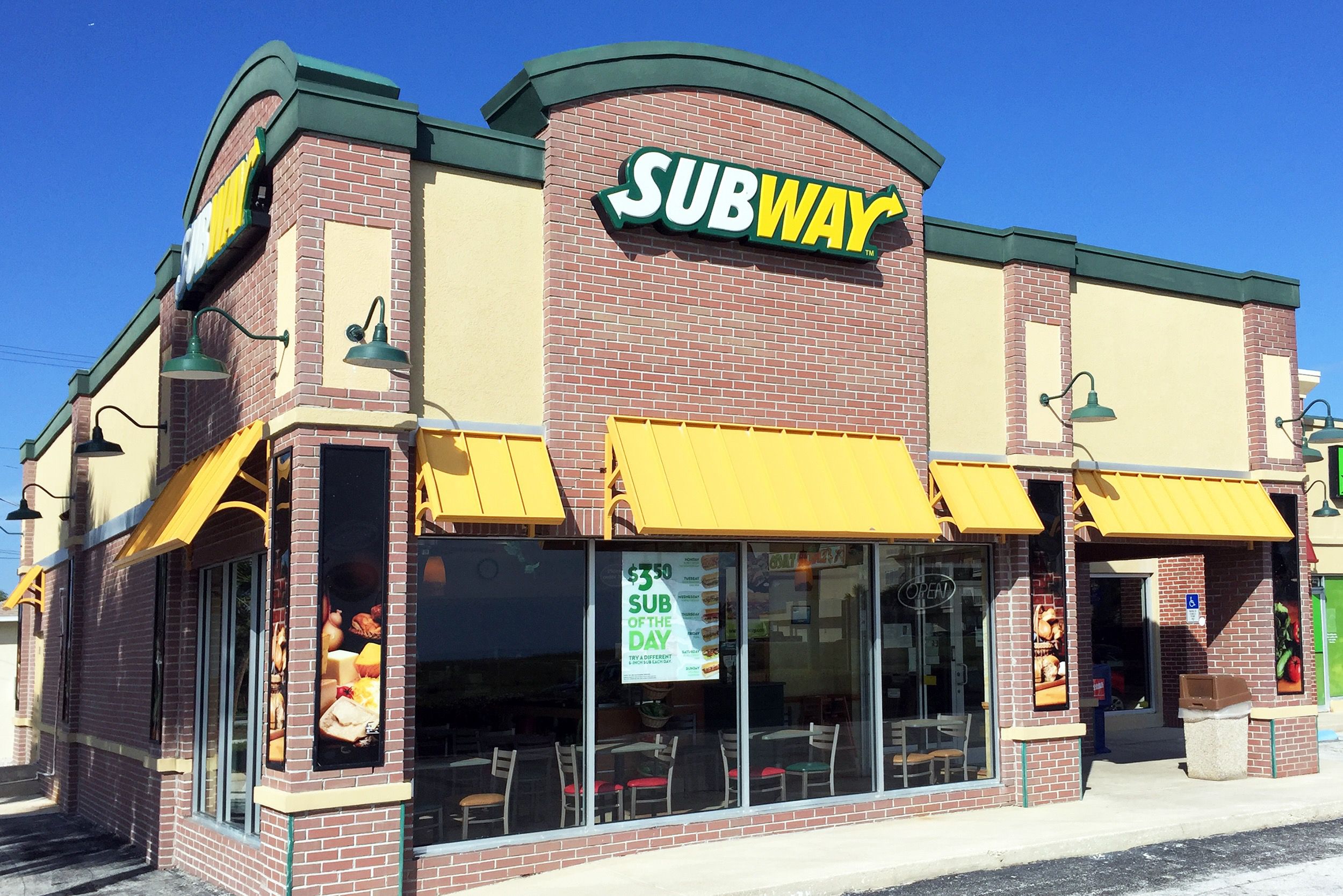 Exterior of Subway restaurant on a sunny day