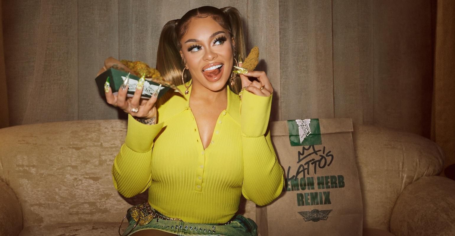 The American rapper Latto with a Wingstop bag with the words 