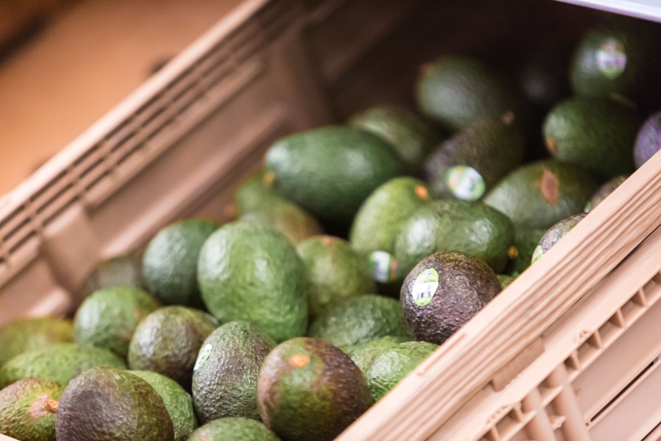 Inside a supermarket with avocados